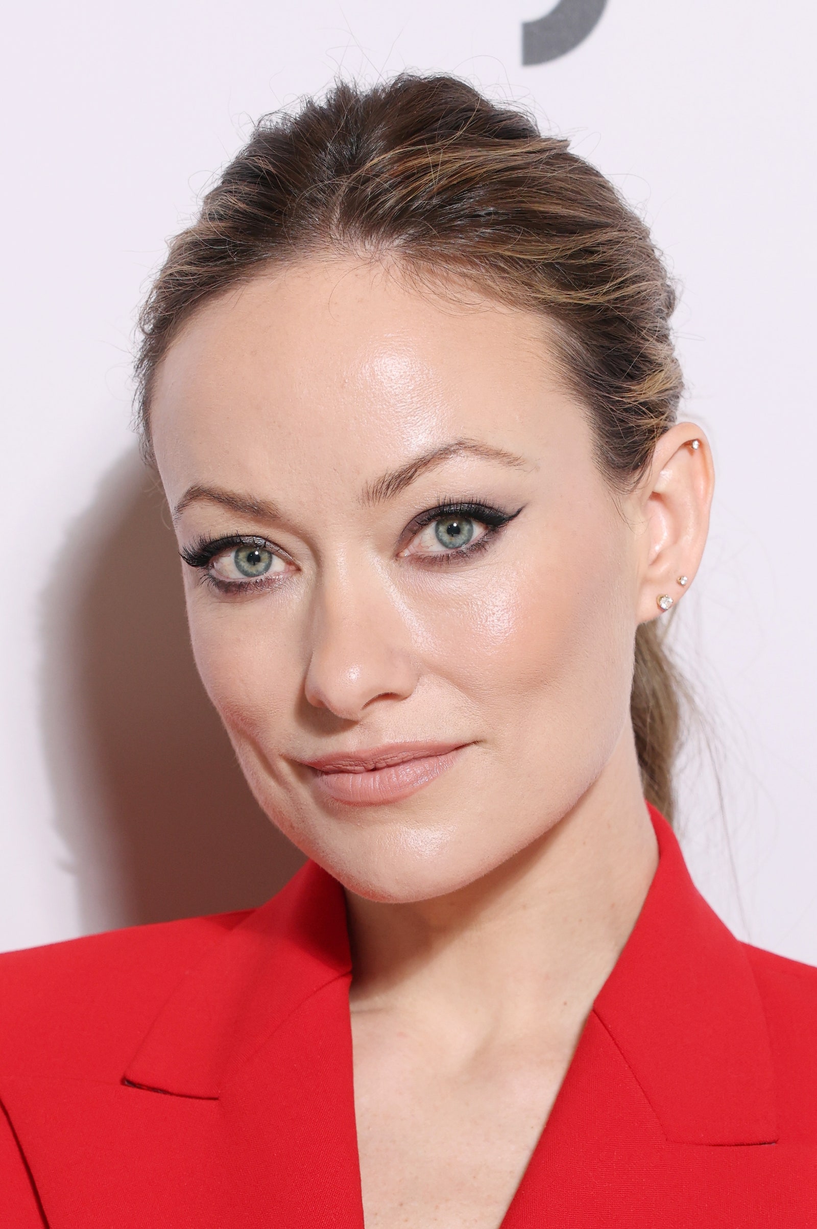 Images may contain Olivia Wilde adult head, face, hair and coat