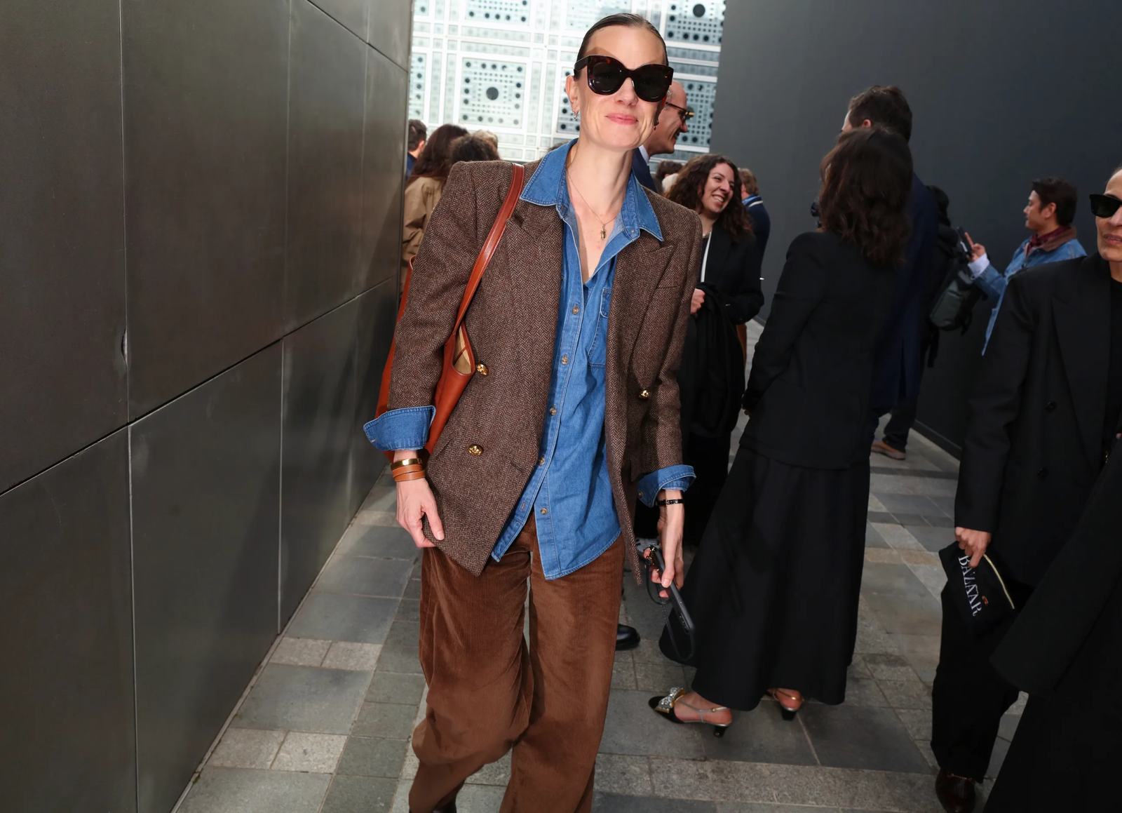 Images may contain Mia doi todd clothing coat adult jacket stylish long-sleeved jacket and walking