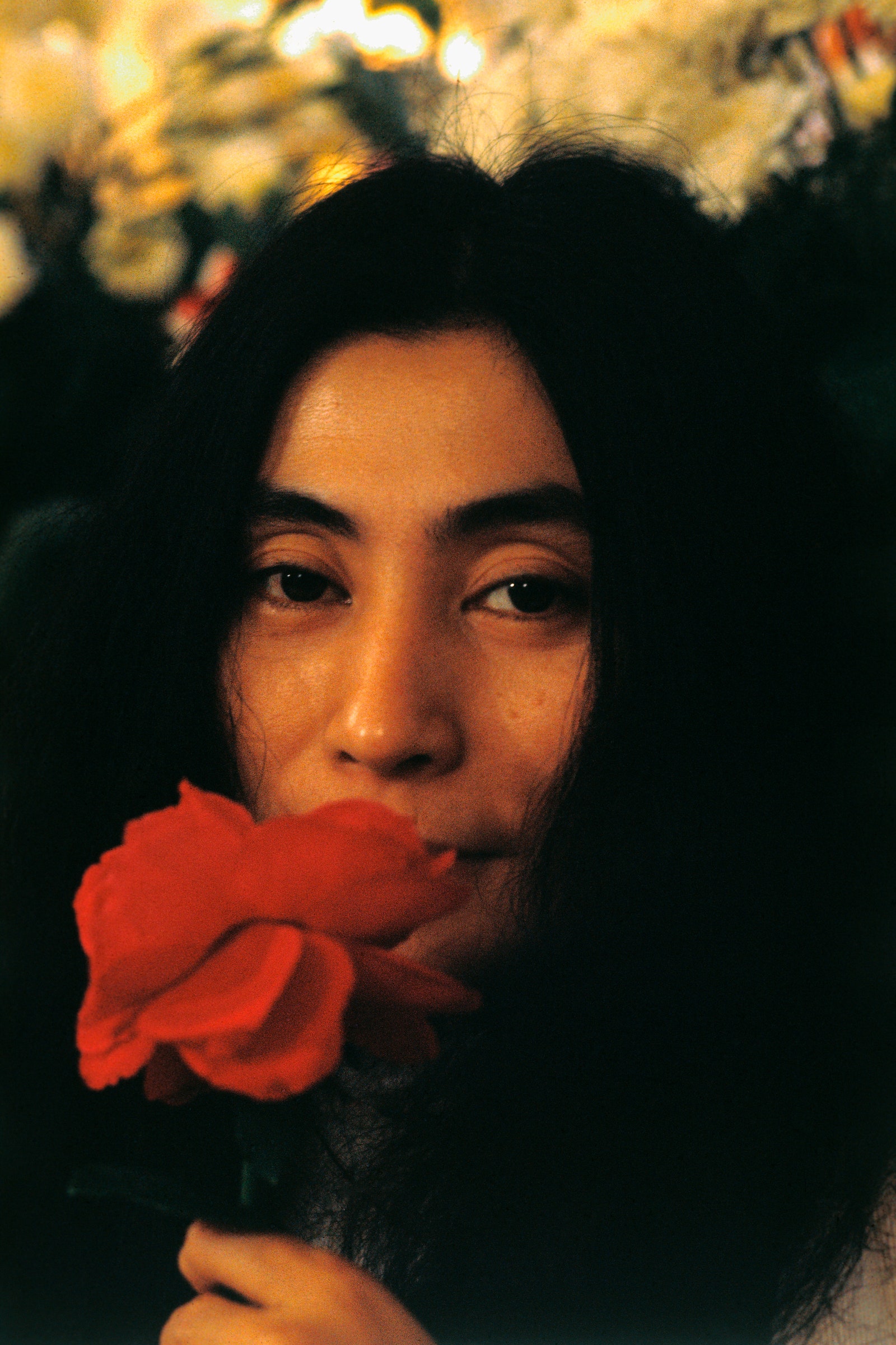 Yoko ono's head lens with roses