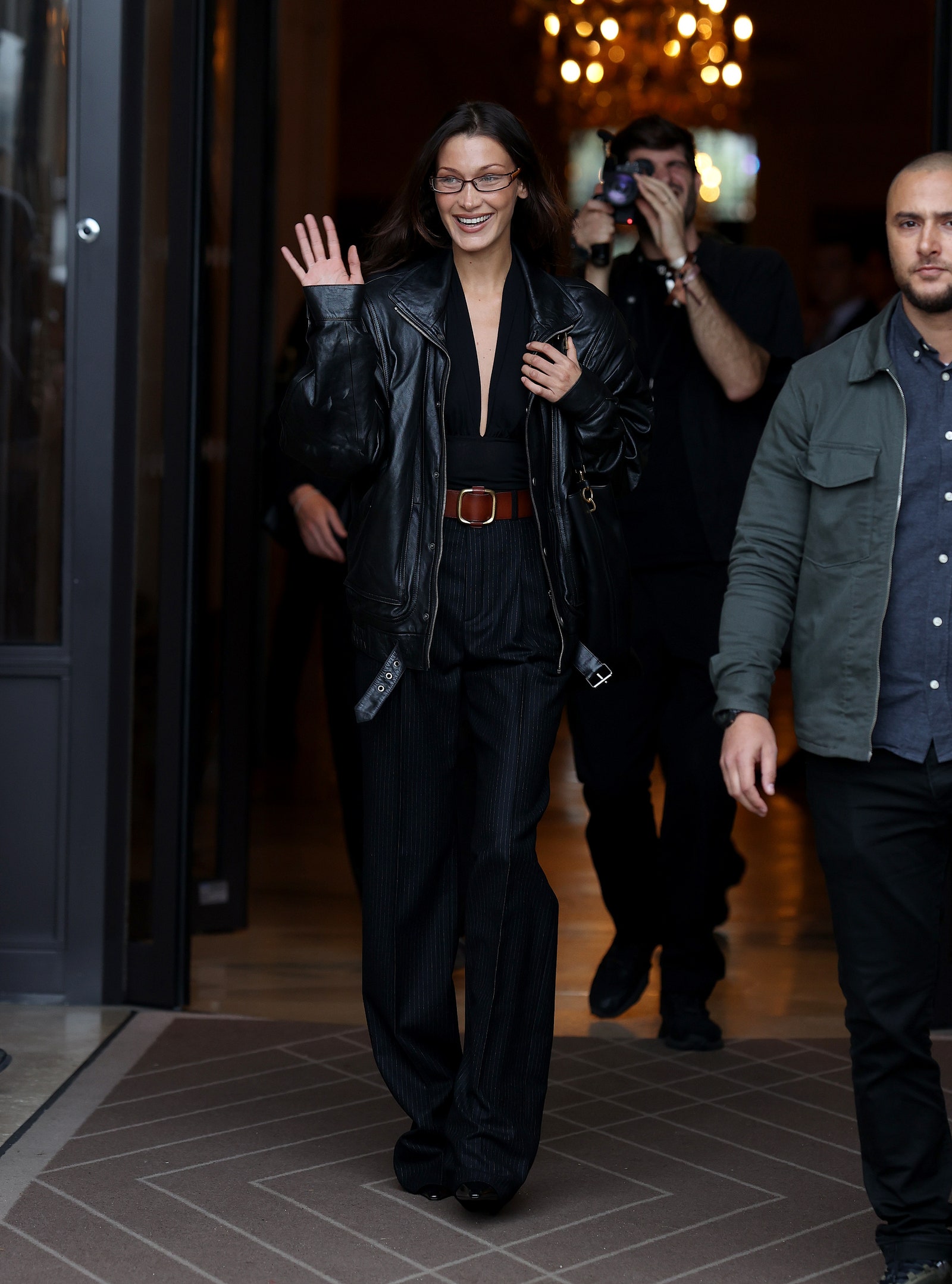 Images may contain Bella Hadid Clothing Jacket Accessories Belt Adult Shoes and Glasses