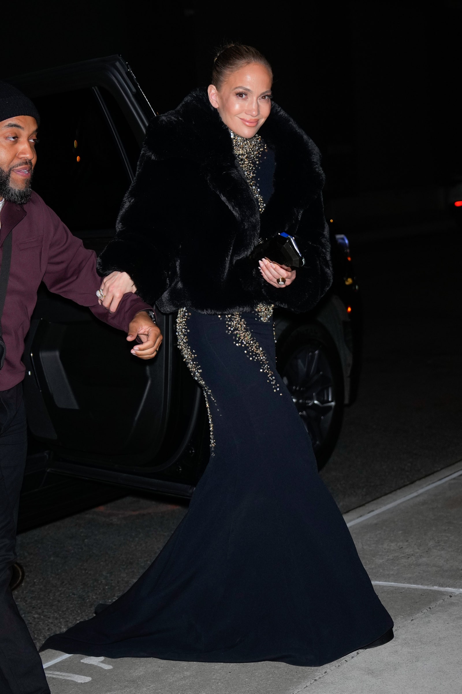 Images may contain Jennifer Lopez Accessories Bag Handbags People Adult Clothing Hats Wedding Dresses and Formal Weddings