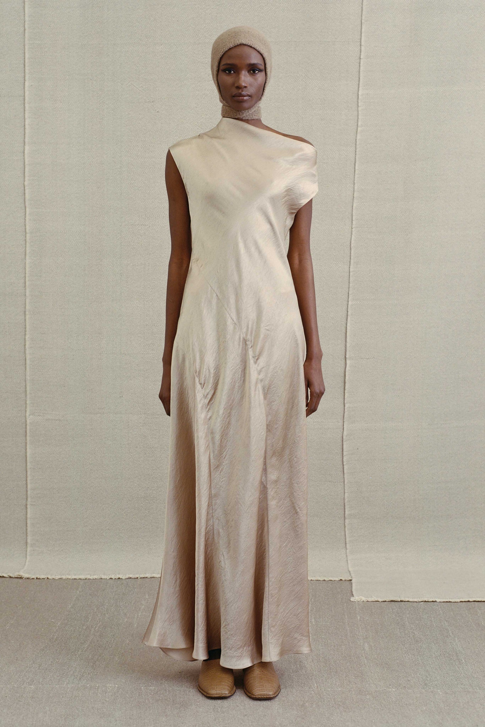 Image may contain Clothing Dress Fashion Formal Wear Gown Long Sleeve Sleeve Evening Dress Wedding and Wedding Gown
