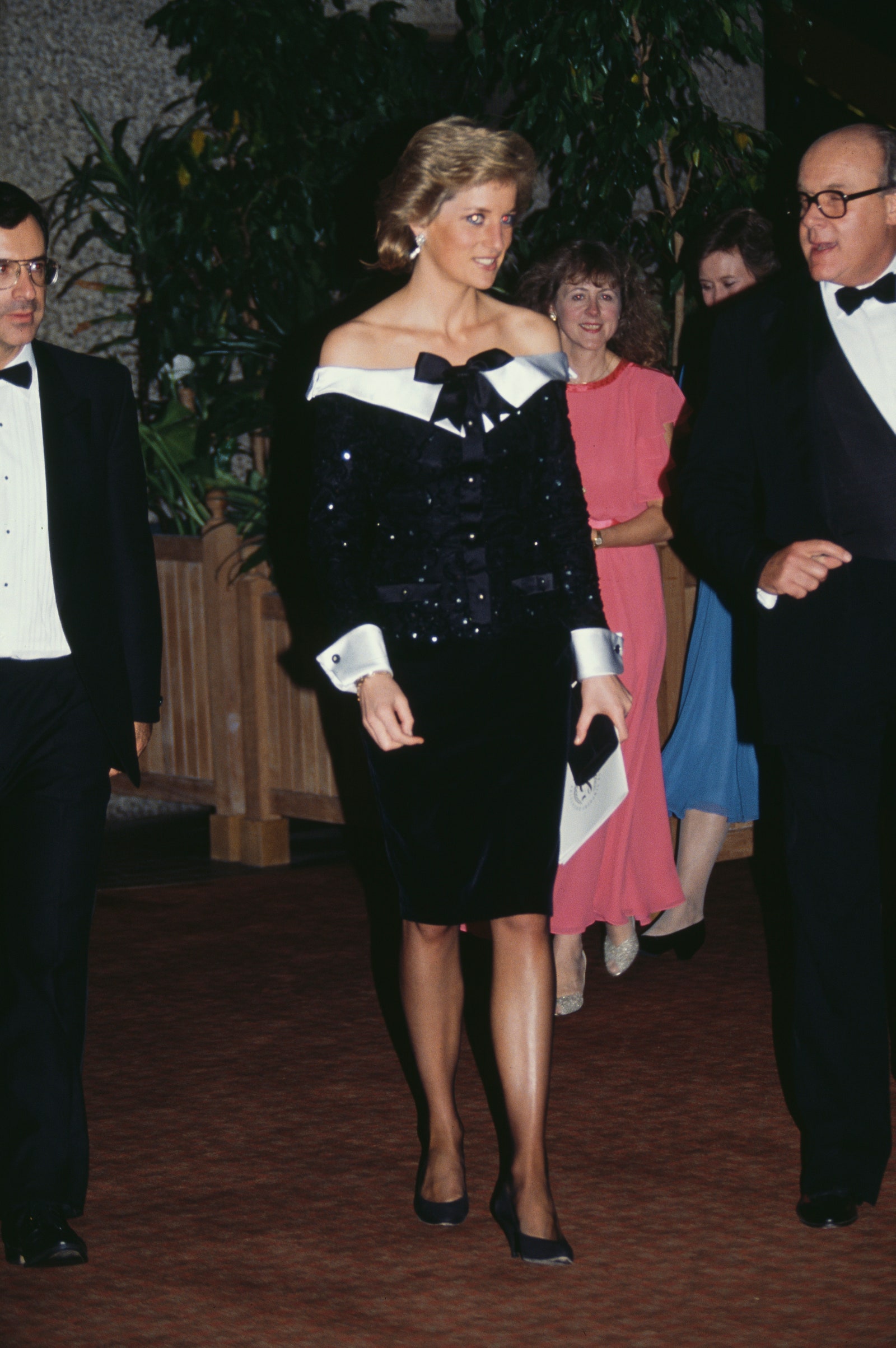 Images may contain Dan Fante Diana, Princess of Wales, Clive Gillinson, people clothing, footwear, heels and shoes