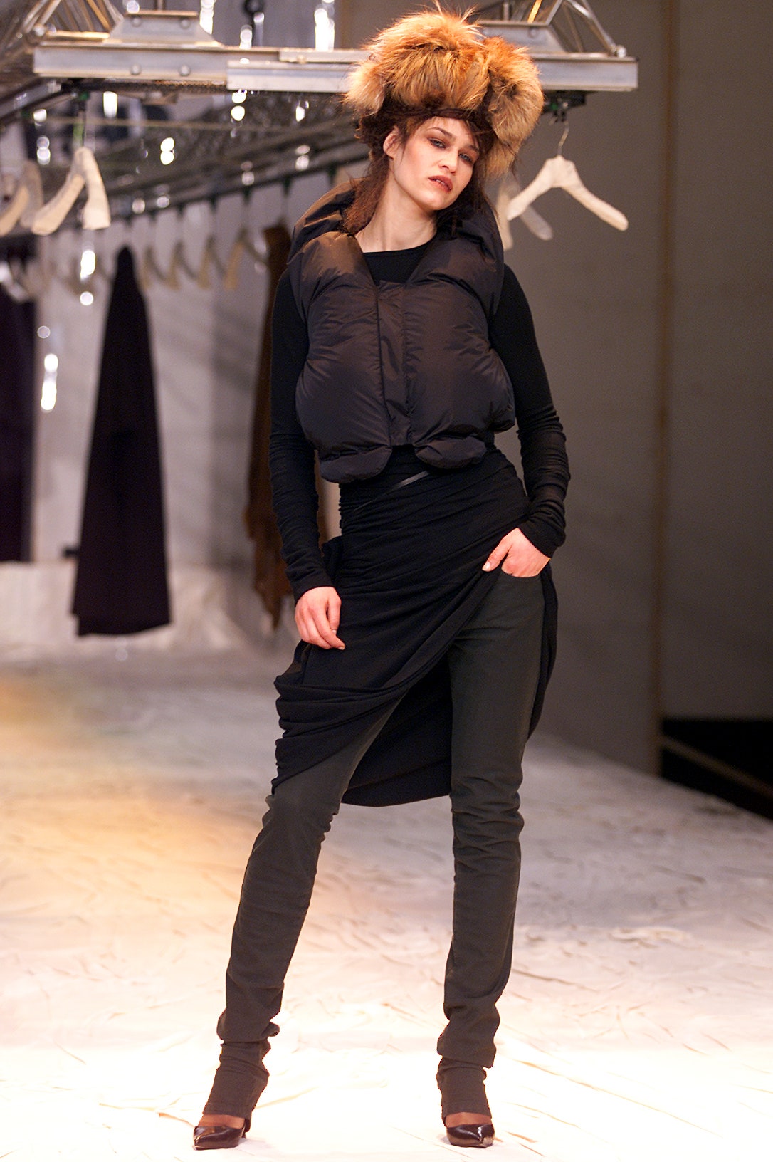 Images may contain clothing sleeves human body long sleeve fashion tracks and footwear