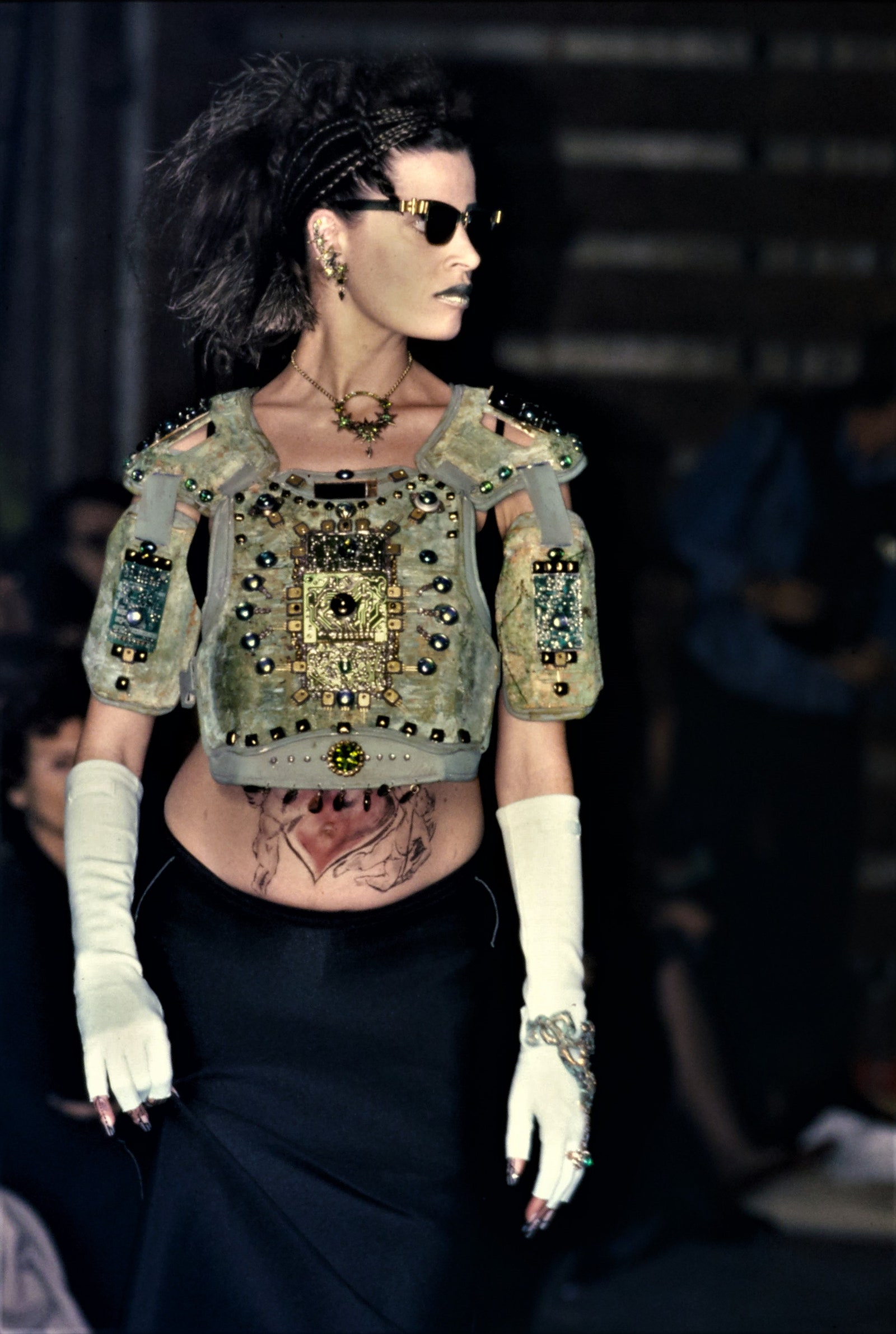 This image may contain skin characters sunglasses accessories clothing sleeves and tattoos