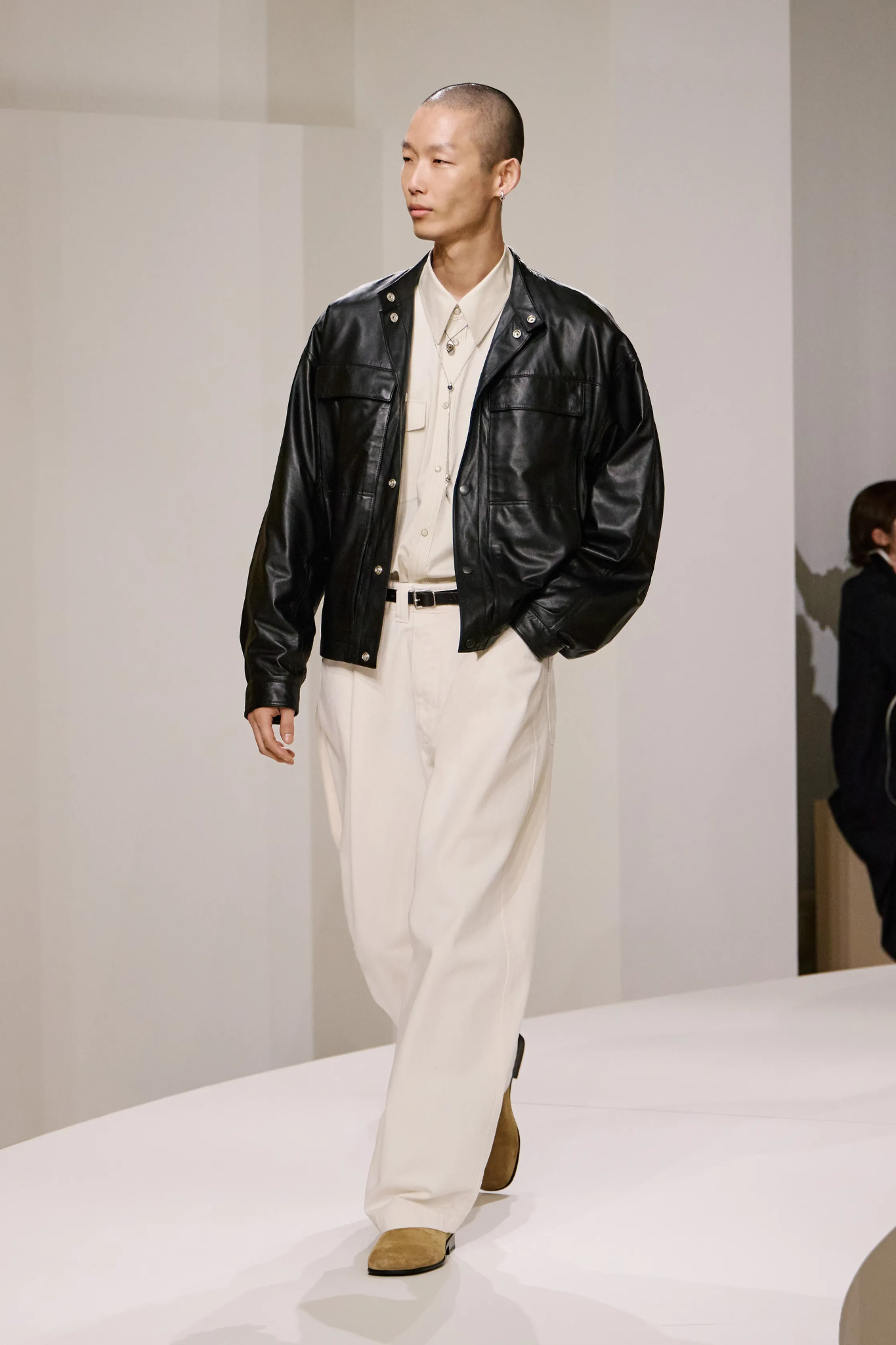 Images may contain Bobby clothing jacket for adults and standing