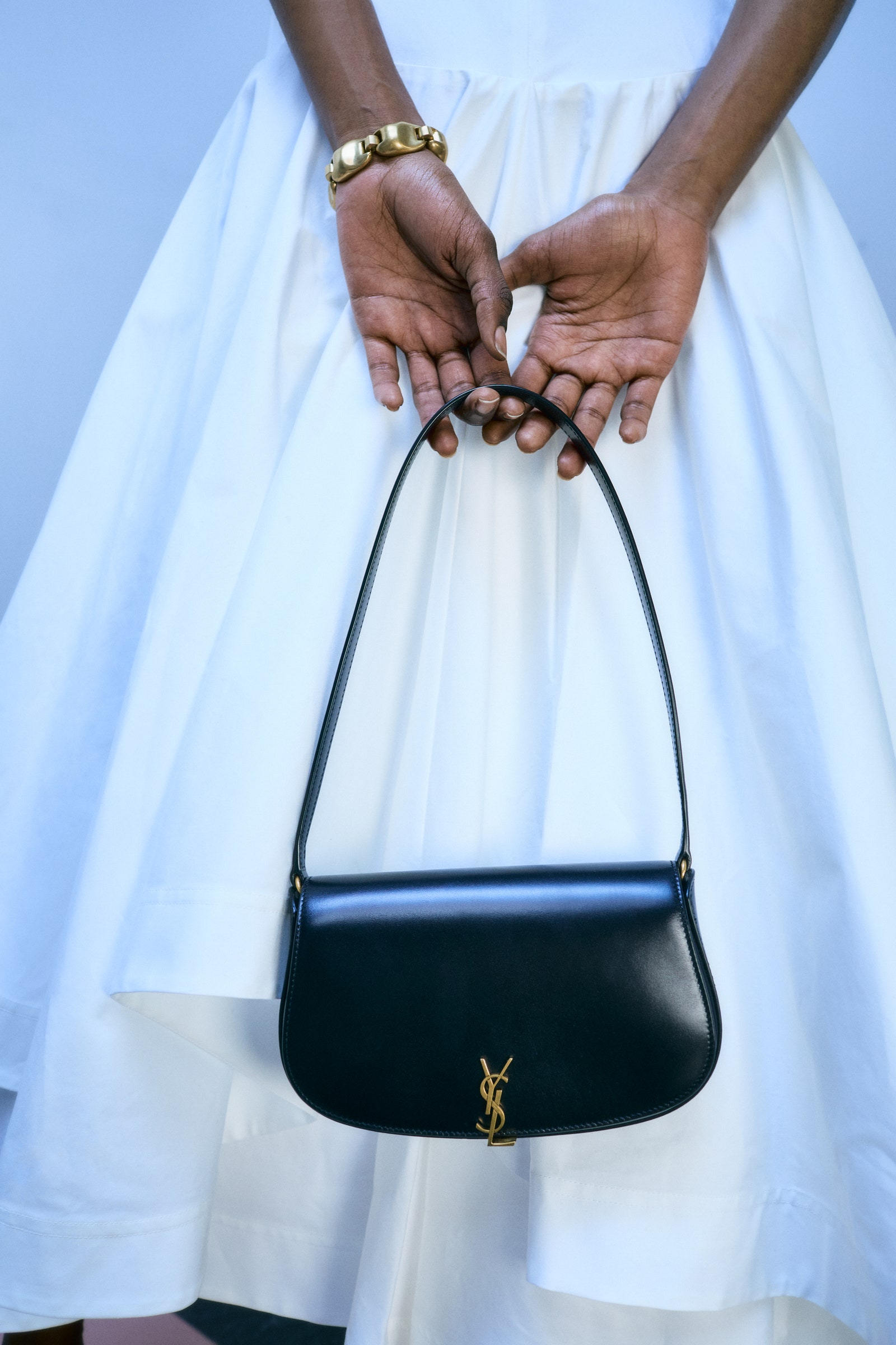 Images may contain accessories tote bag handbag watch adult and wedding