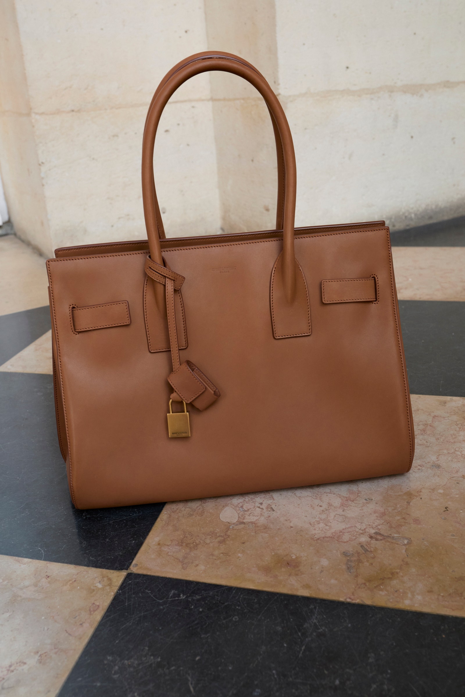 Images may contain accessories for handbags and wallets