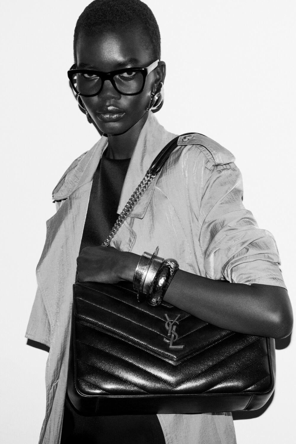 Images may contain accessories bag handbag wallet adult glasses face and head