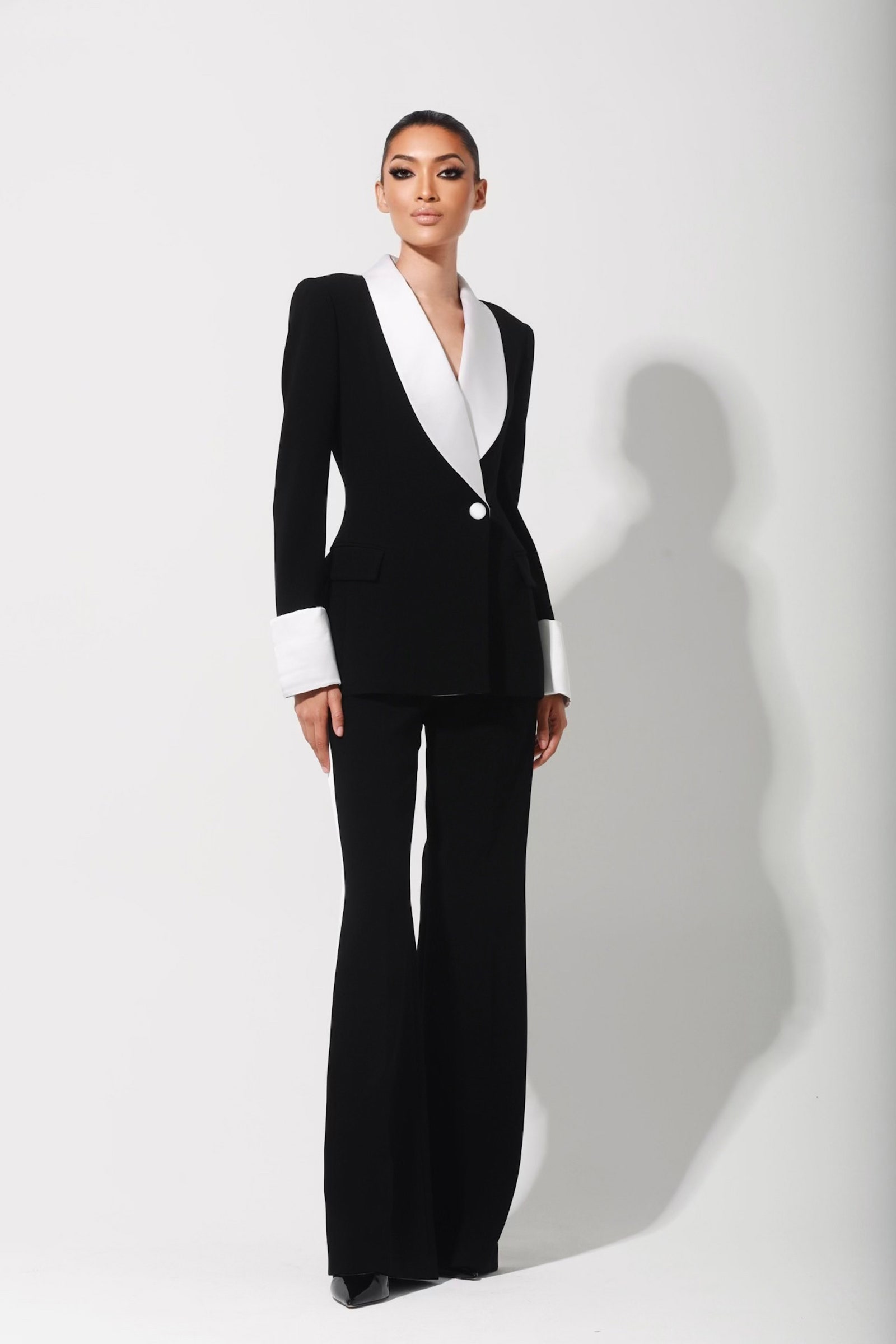Images may contain clothing formally wearing suit tuxedo adult jacket and dress