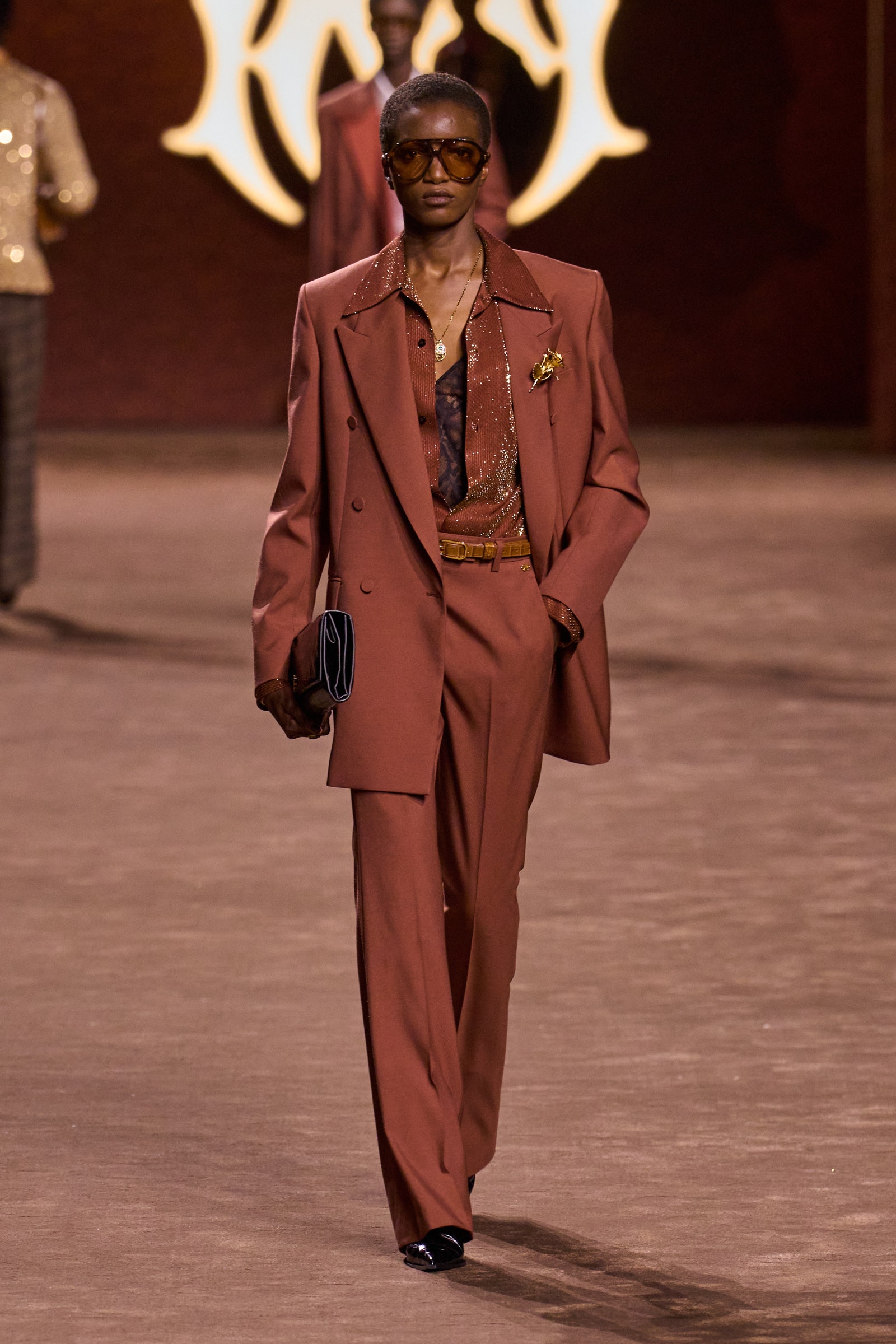 Images may contain clothing formally wearing suits fashion adult accessories jewelry and necklaces