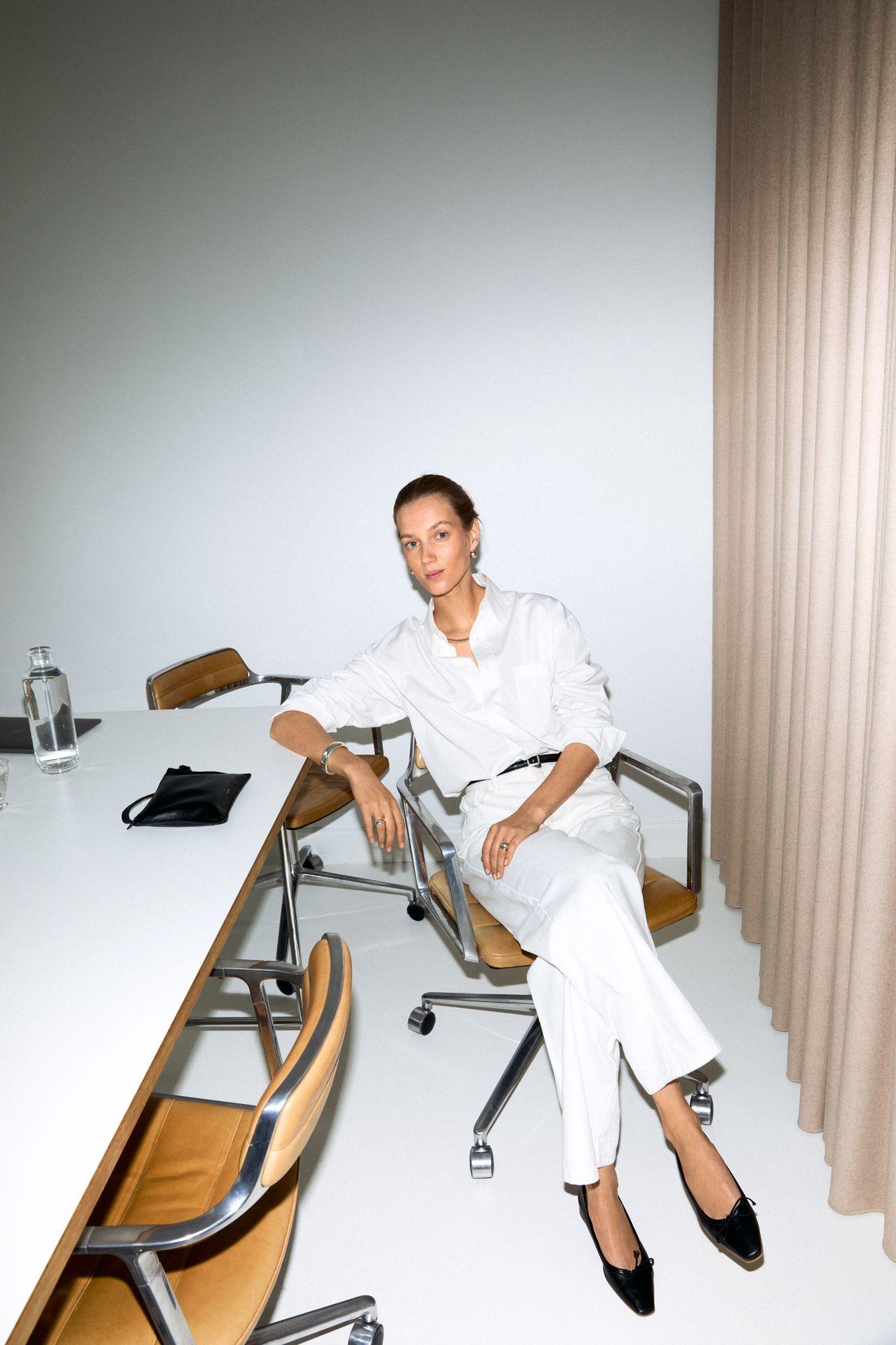 Image may contain Anja Rubik Men's Chair Furniture Adult Table Accessories Handbags and Belts