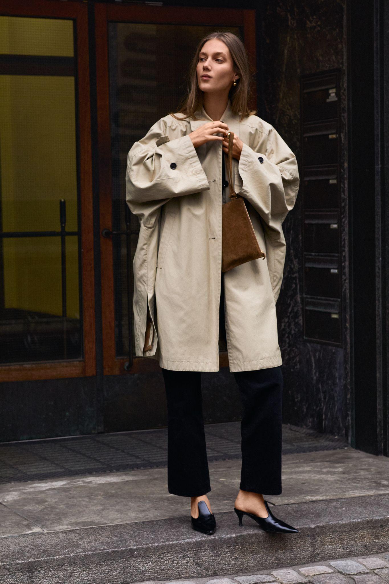 Images may contain Anja Rubik clothing jacket adult accessories bag handbag coat shoes and high heels