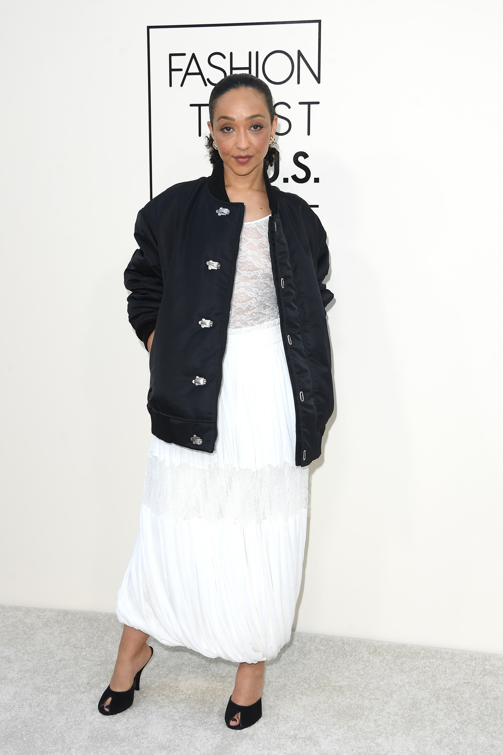 Images may contain Ruth Negga Clothing Jacket Adult Adult Footwear High Heels and Long Sleeves