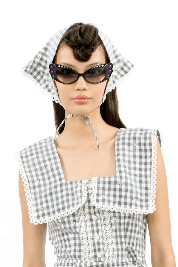 Images may contain shirt clothing accessories sunglasses hat adults and people