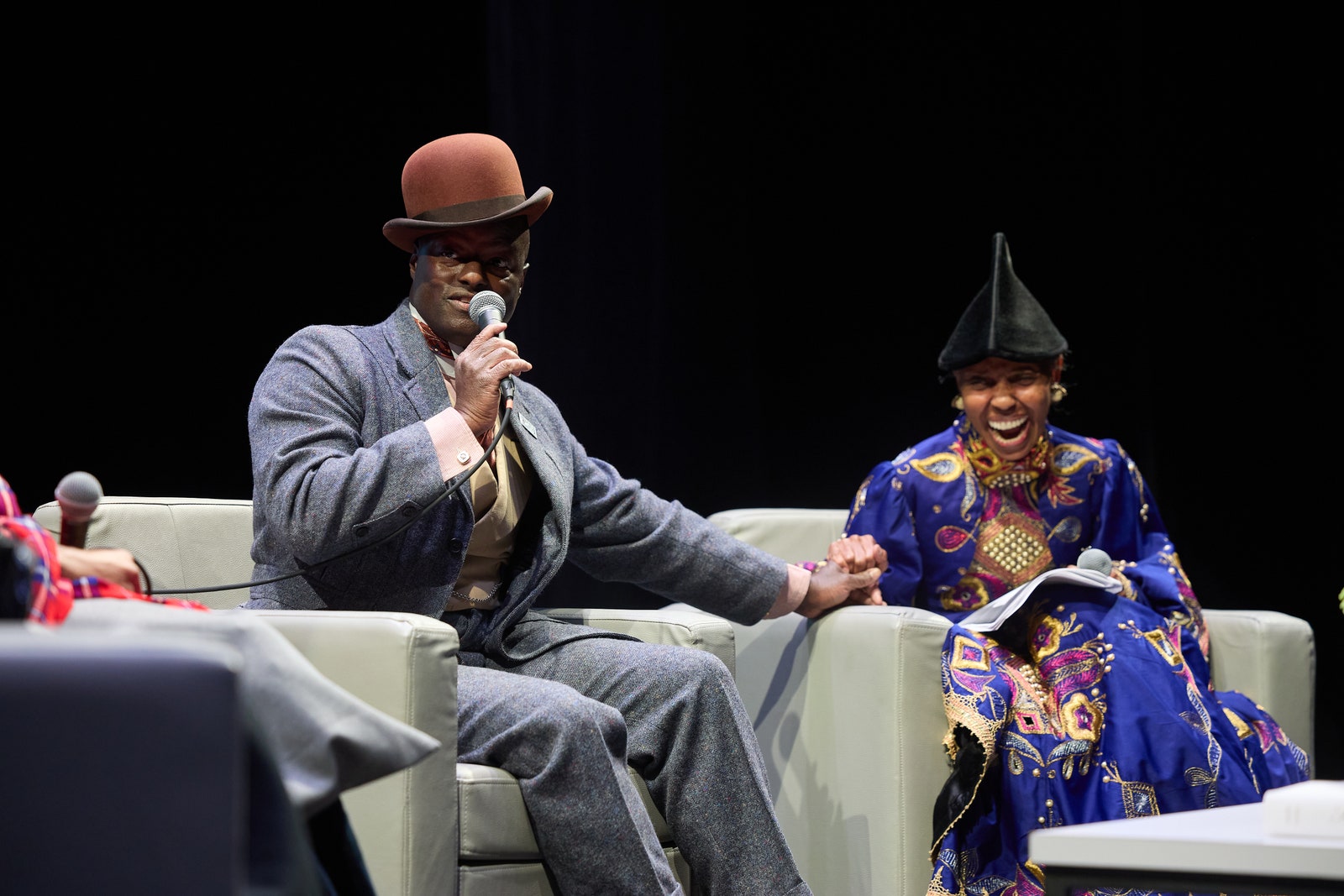 Images may contain Elly Tumwine Miriam Makeba Adult Clothing Hat Electrical Equipment and Microphone