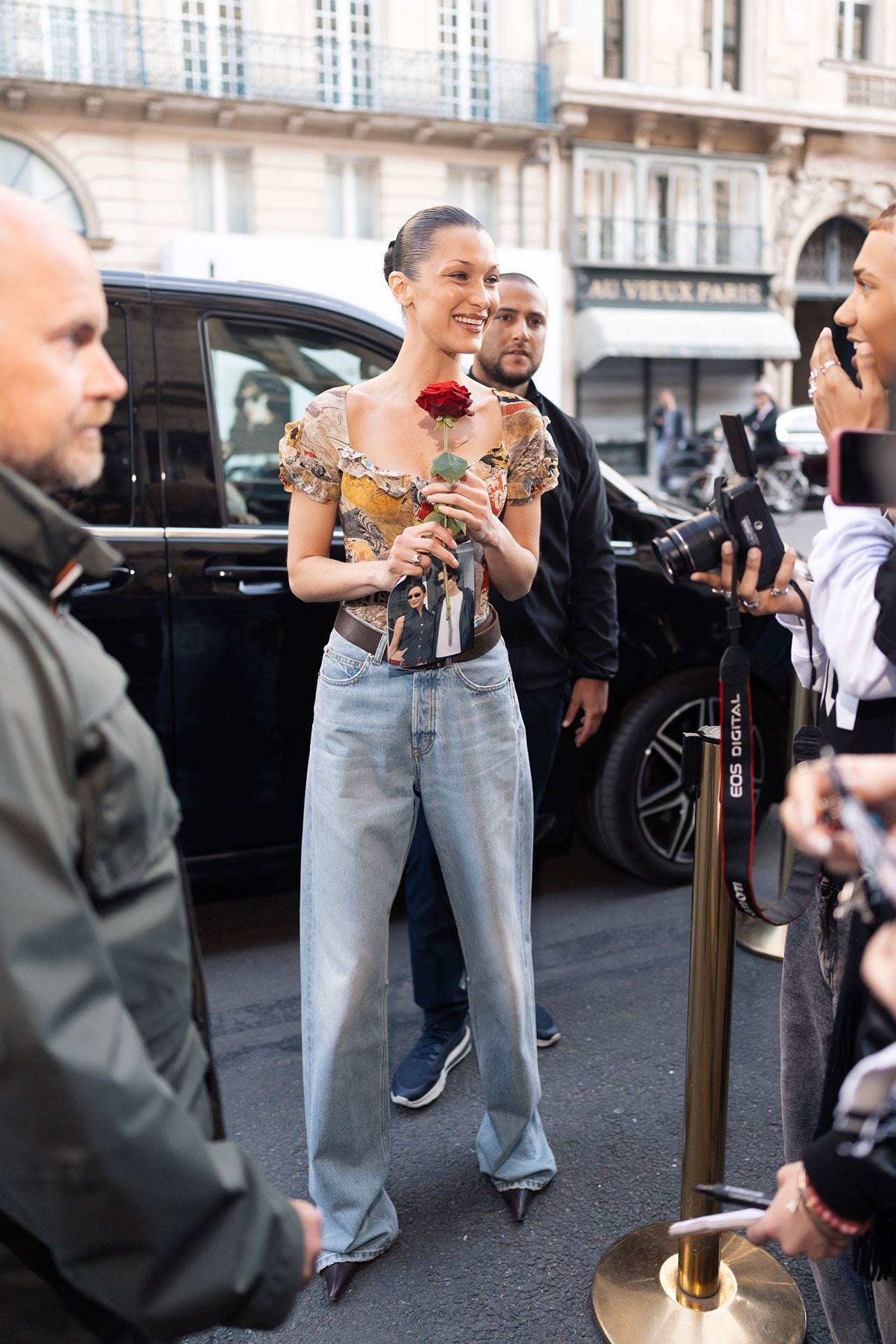 Images may contain Bella Hadid Cris Judd clothing pants shoes adult head-face jeans and cars