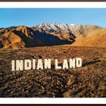 In the desert, the word is illuminated by white letters on Indian land, similar to the Hollywood logo.