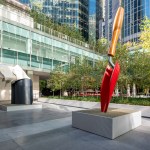 Monumental sculpture of red garden trowel and handkerchief.