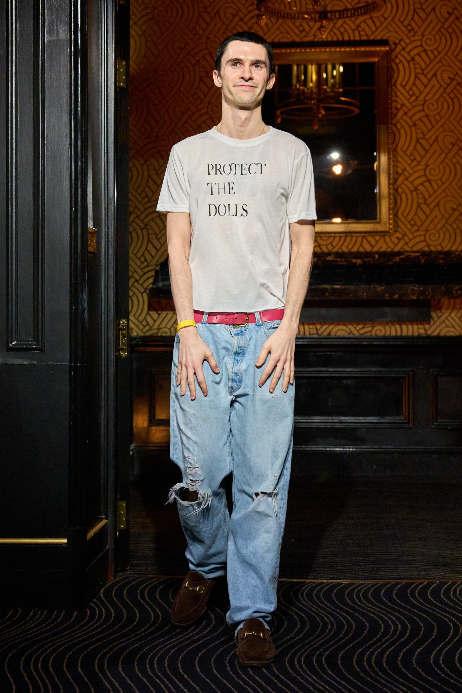 Image may contain people standing jeans accessories belt shoes shoes adult bracelet and jewelry