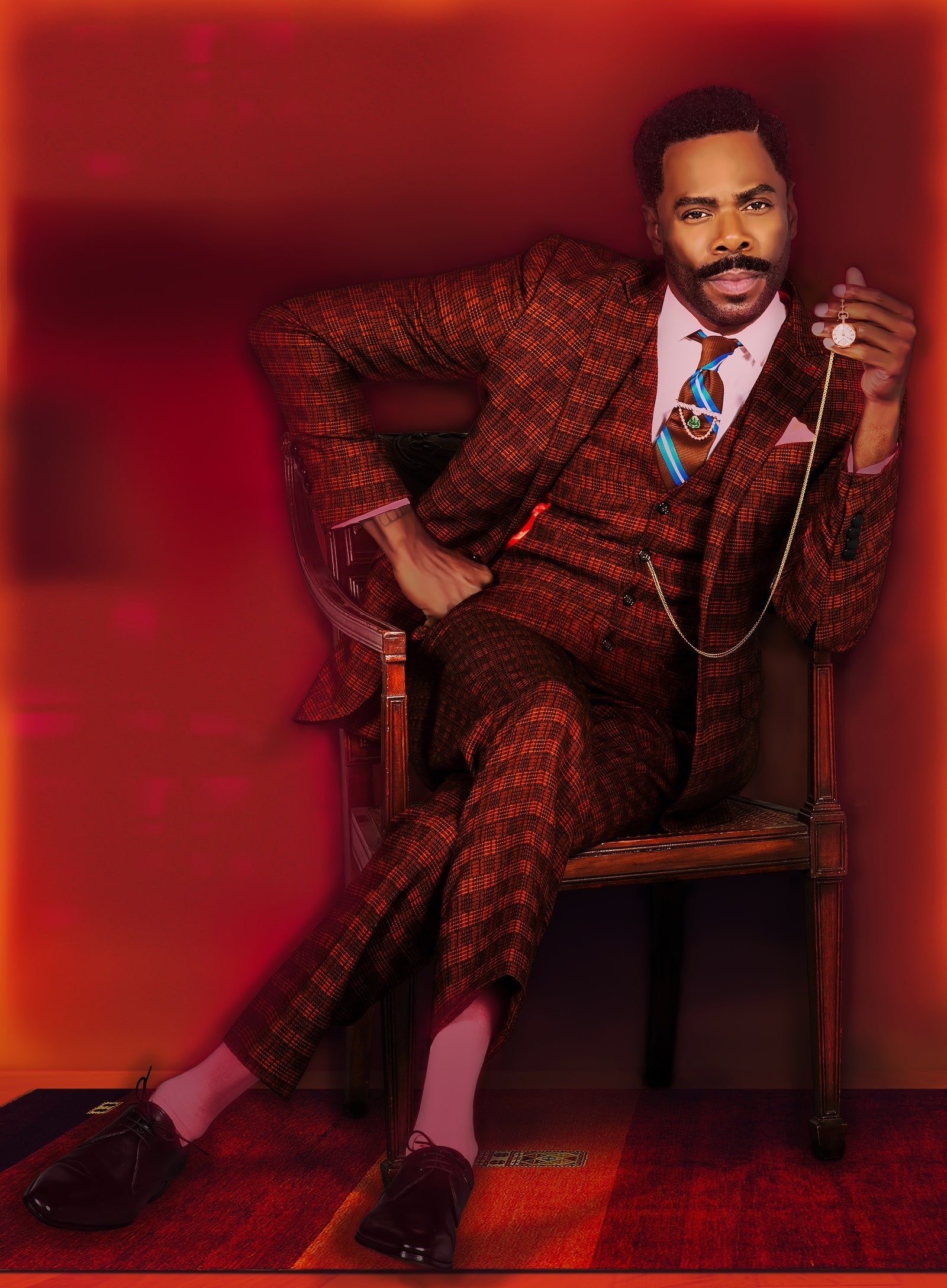 Images may contain Colman Domingo man sitting in clothes formally wearing suit accessories tie adult blazer and blazer