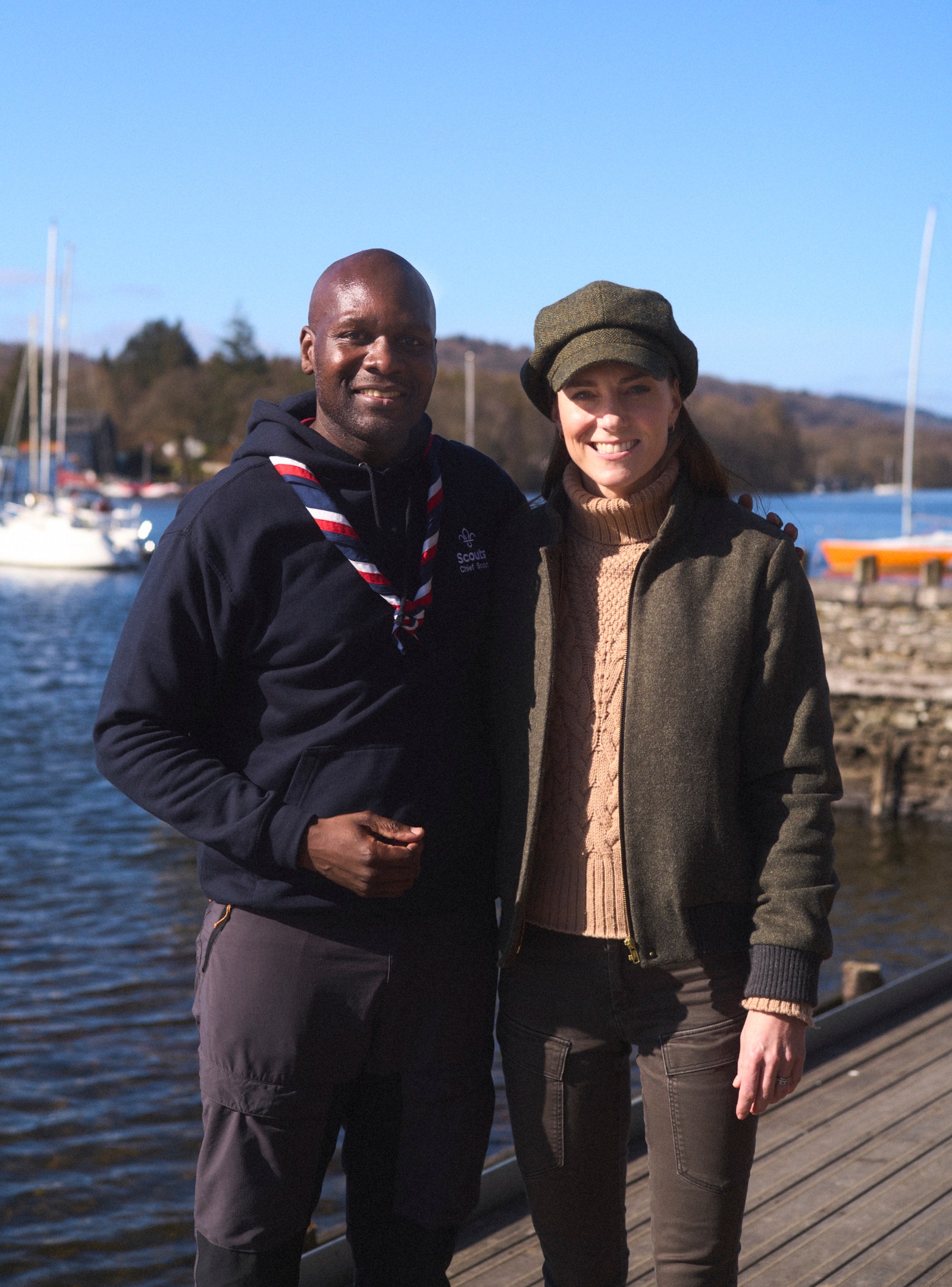 Images may contain seaside clothing jacket facial head photography portrait pants and port