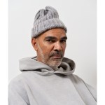 Portrait of Daniel Boyd wearing a grey beanie and grey hoodie.