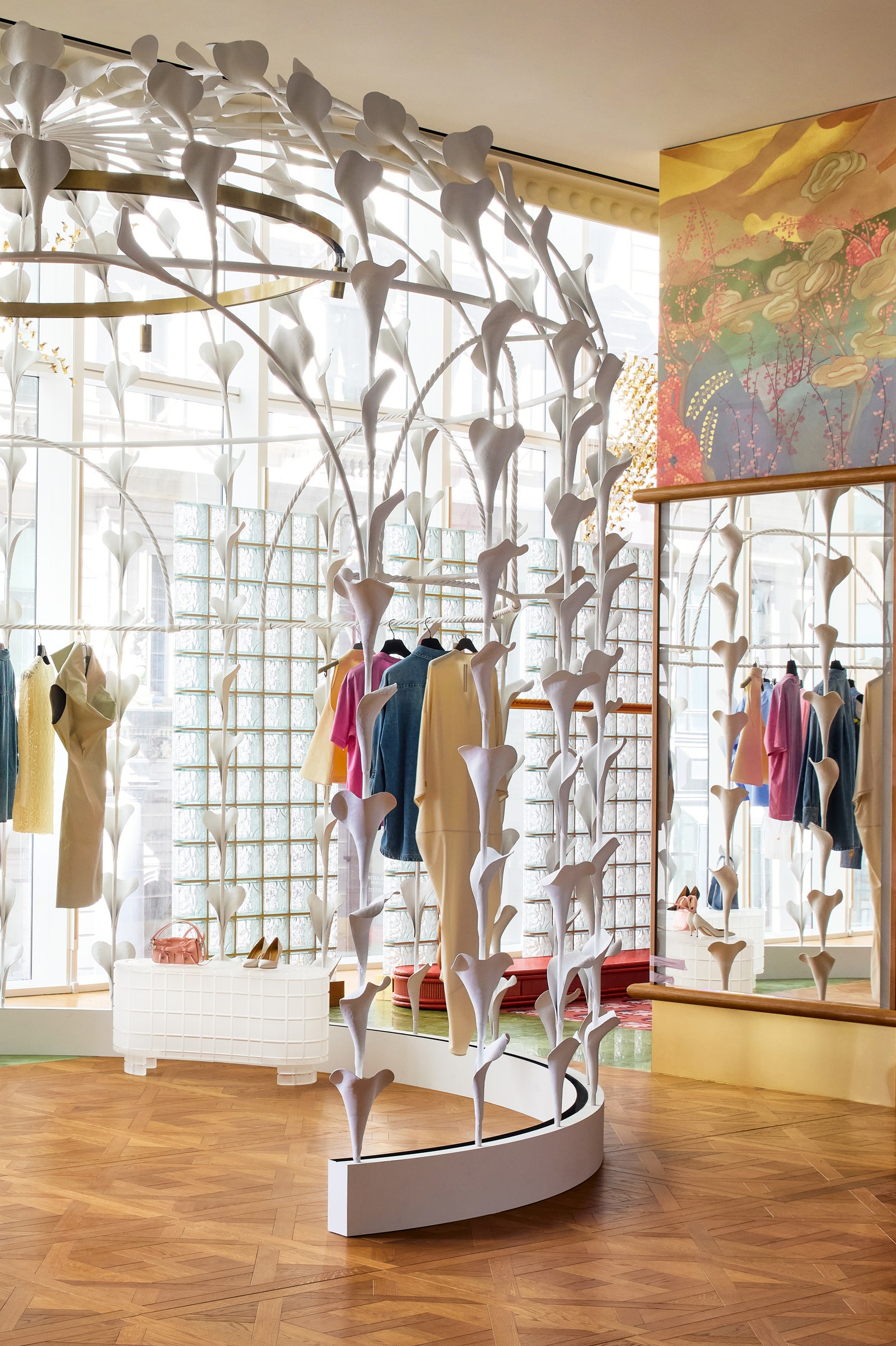Image may contain accessories bags handbags clothing footwear high heels in indoor store furniture and people