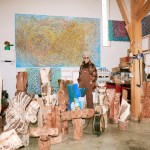 The portrait of Jin Yun is in her studio surrounded by colorful paintings and wooden sculptures. Courtesy of artists, Lehmann Maupin in New York, Seoul and London; and Kukje Gallery, Seoul and Busan. Photography by Lee Woojeong.