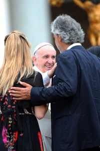 Vatican Vatican - July 3, 2003: Pope Francis greets Italian tenor Andrea Boseli at a meeting with members of the Holy Spirit renewal, who attended the 38th annual meeting in the Vatican city of Vatican on July 3, 2015. Pope Francis emphasizes the universal dimension of the charisma movement, rooting it in our shared baptism. (Photo taken by Franco Origlia/Getty Images)