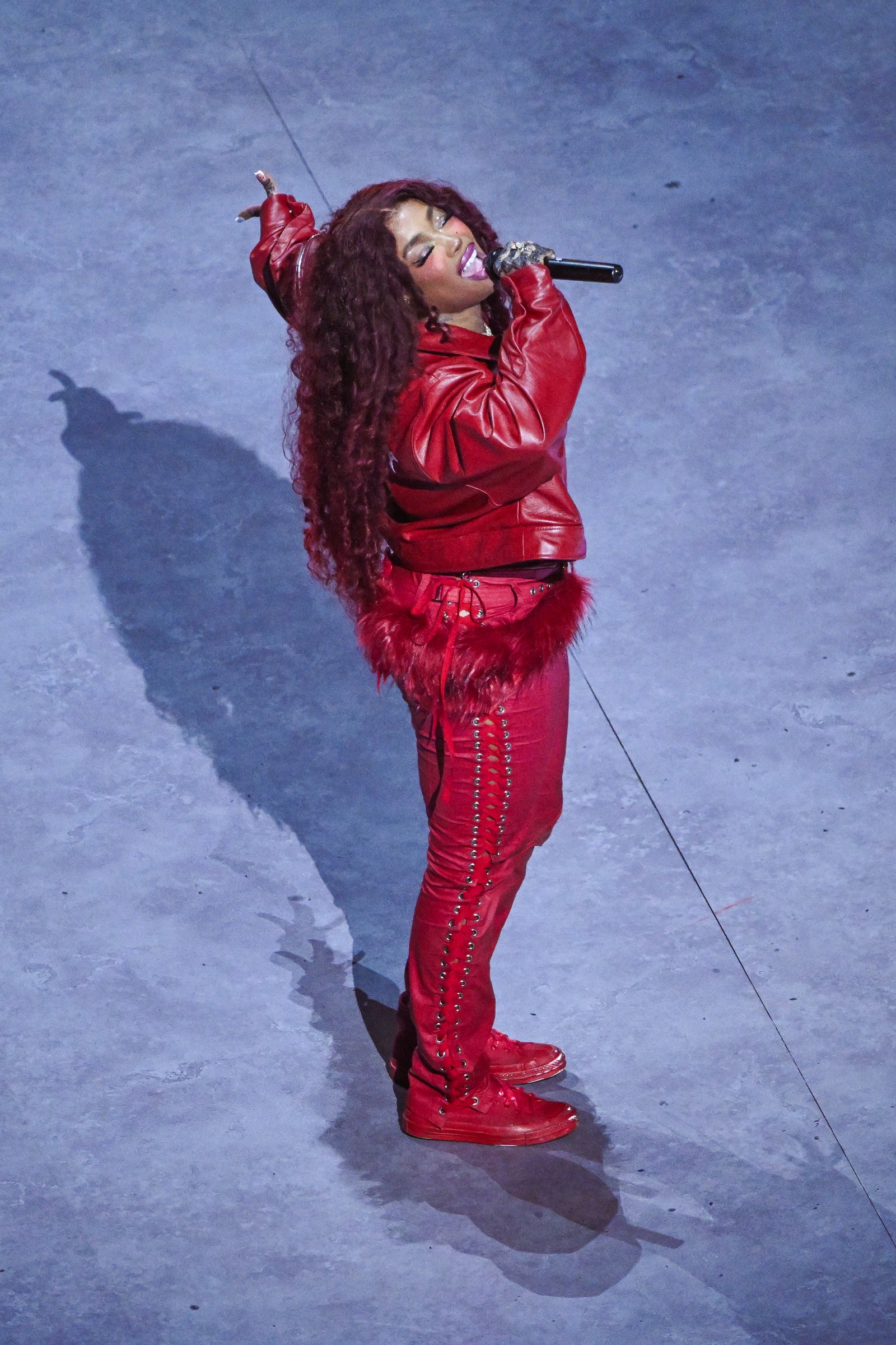 Images may contain SZA performer solo adult clothing jacket footwear and shoes