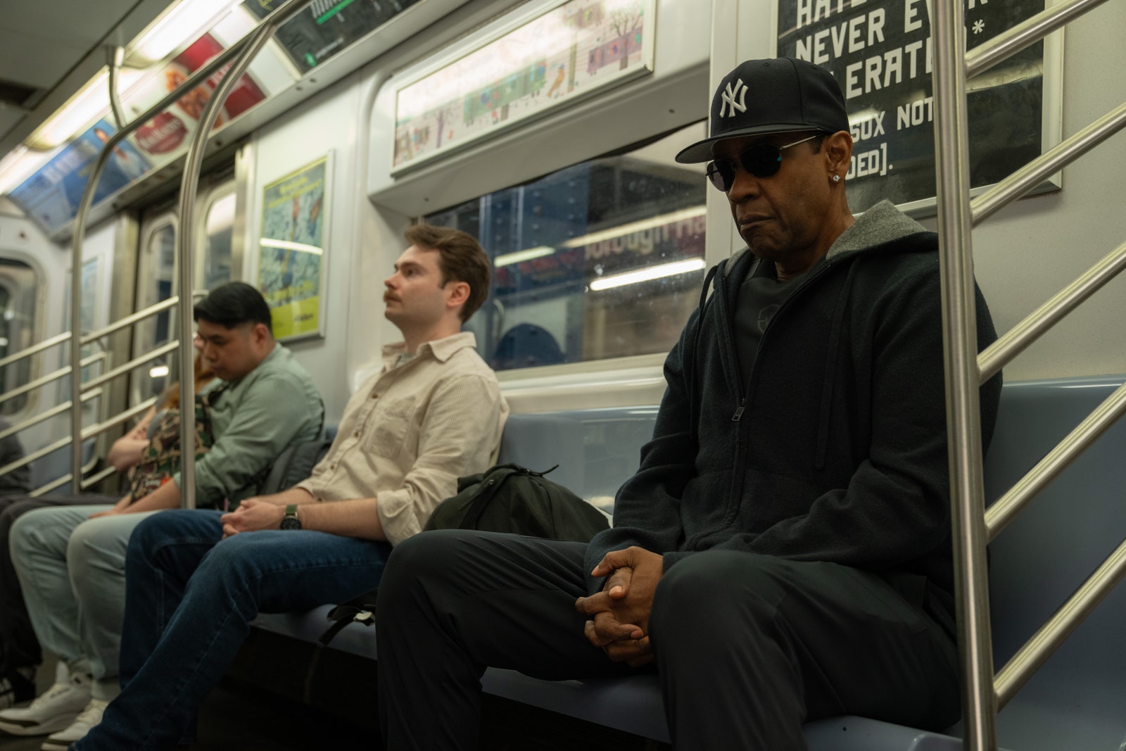 Images may contain Denzel Washington terminal clothing hat accessories glasses adult baseball cap and hat