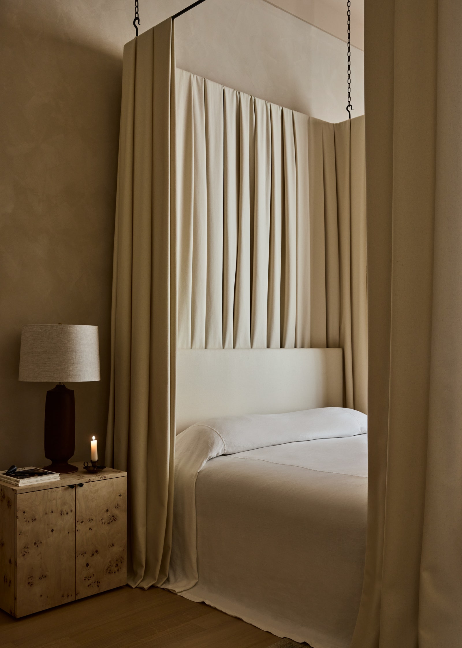 Images may contain furniture in interior light bed bedroom room book publication candle and ceiling bed