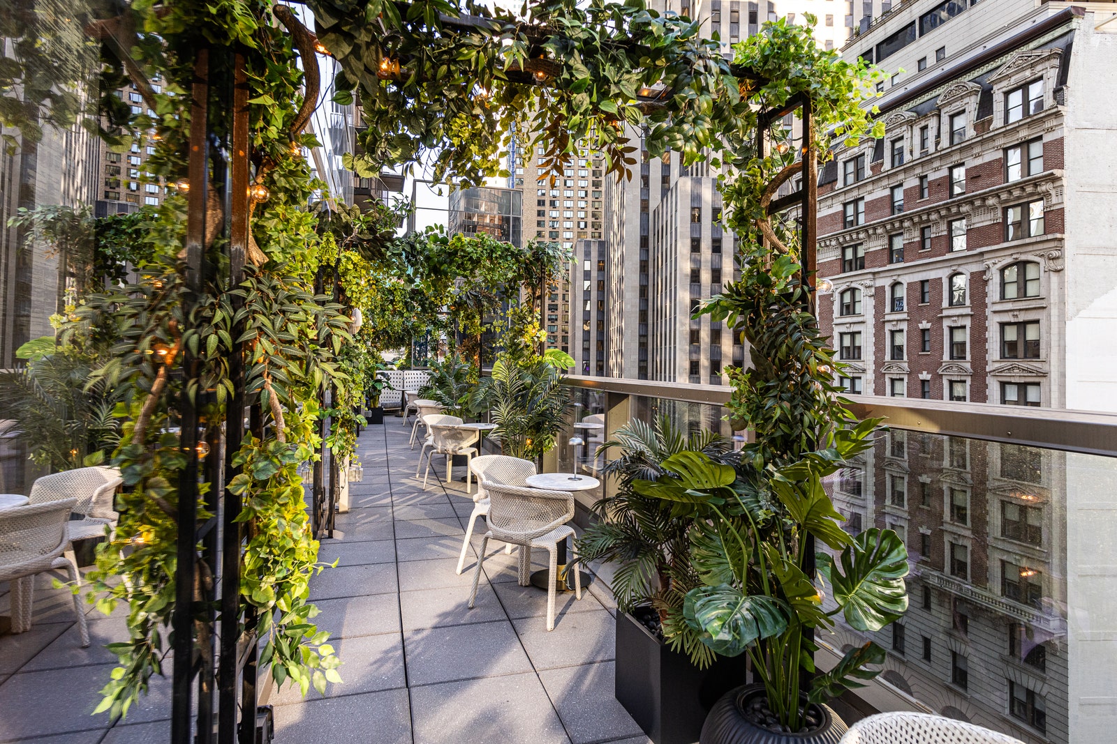 Image may contain urban city garden nature outdoor table furniture table chair building balcony and building
