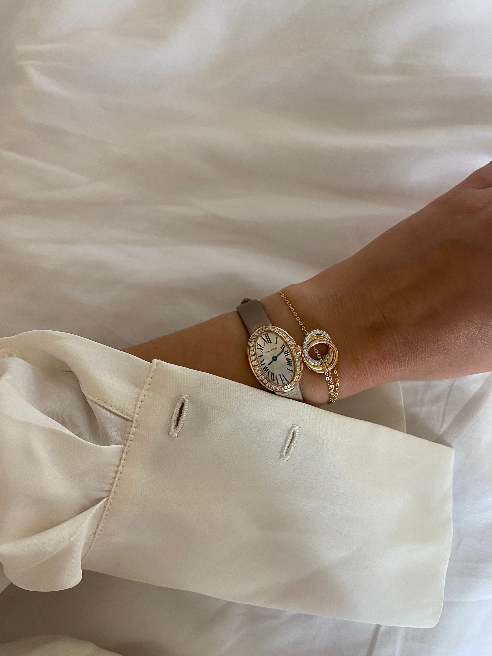Images may contain cuff accessories bracelet jewelry watch arm body parts and people