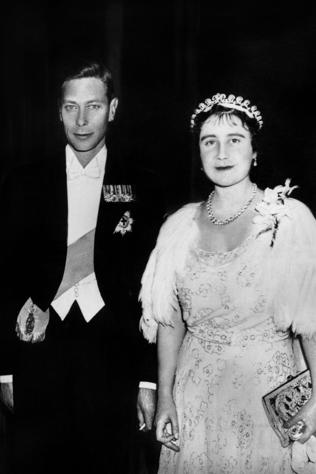 Images may contain Queen Elizabeth Queen Elizabeth George VI adult wedding accessories face and jewelry