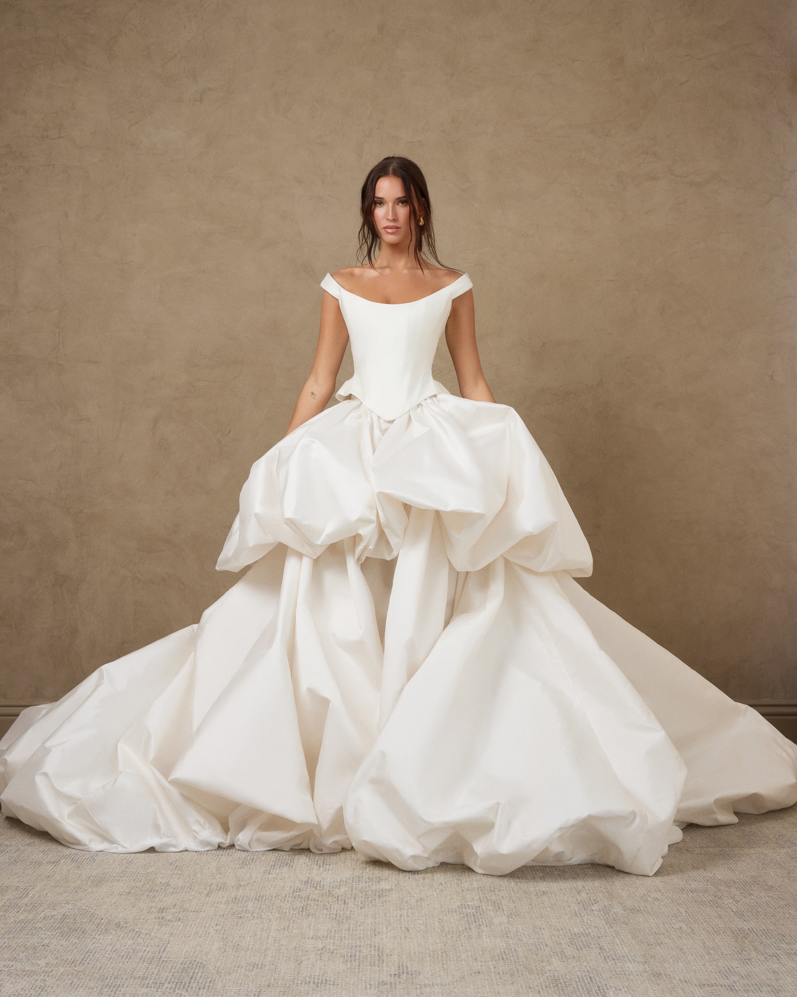 Images may contain Erin Hawksworth clothing dress fashion formal wear dress wedding dress adult and man