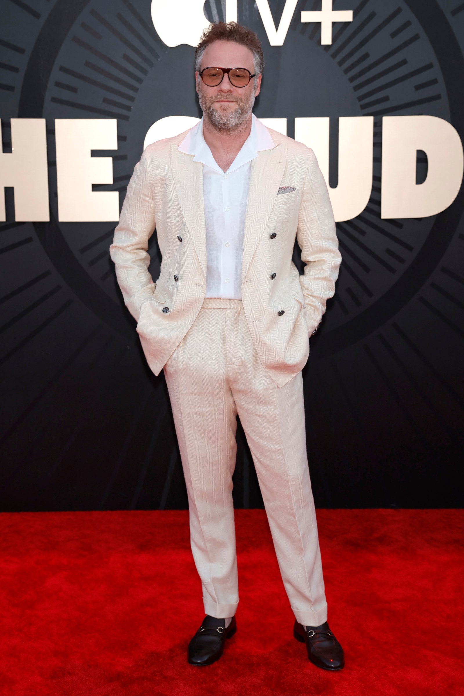 Images may contain adult accessories and glasses for Seth Rogen fashion clothing formal clothing staff standing