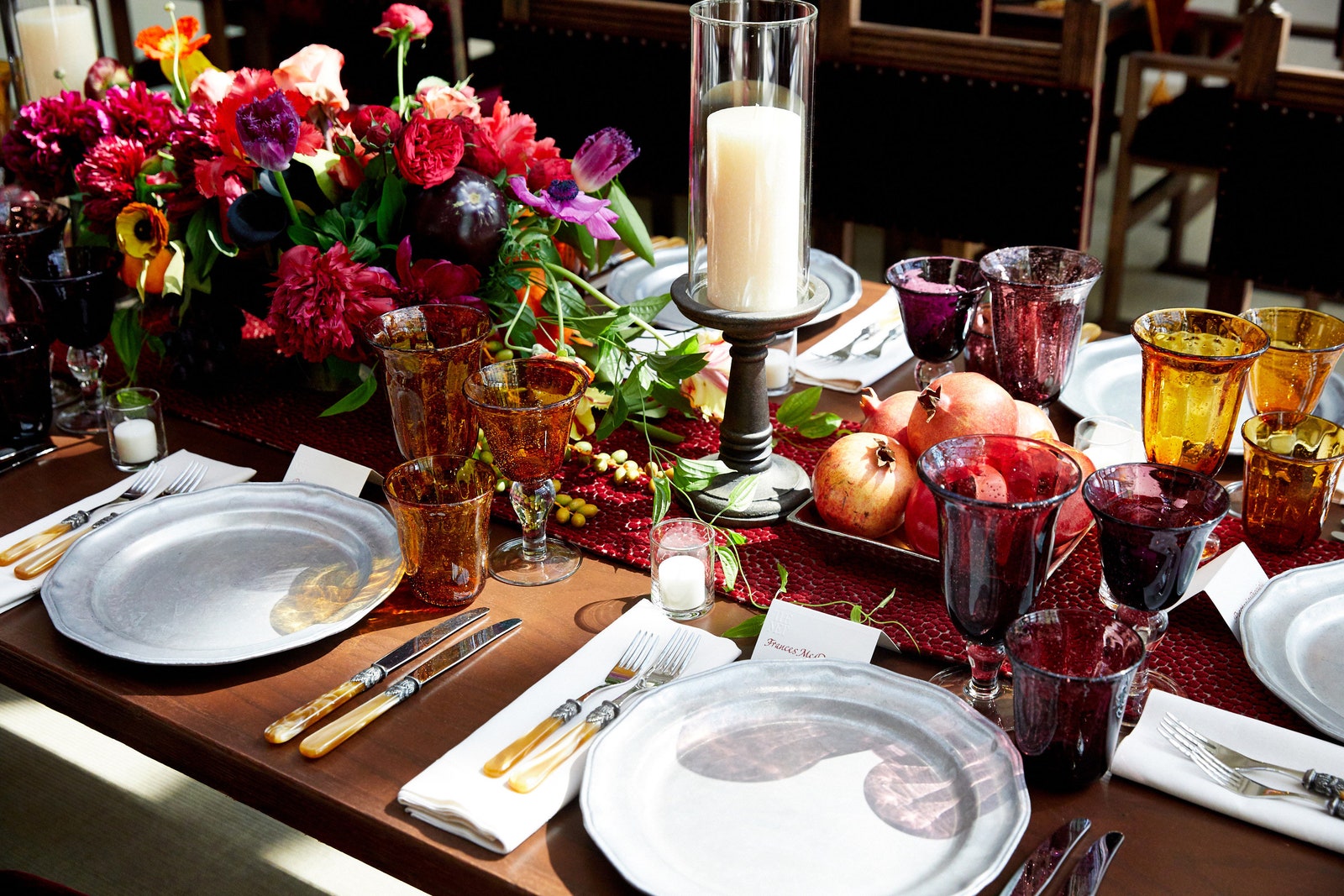 This image may contain plant glass candle flowers arrangement bouquets and furniture