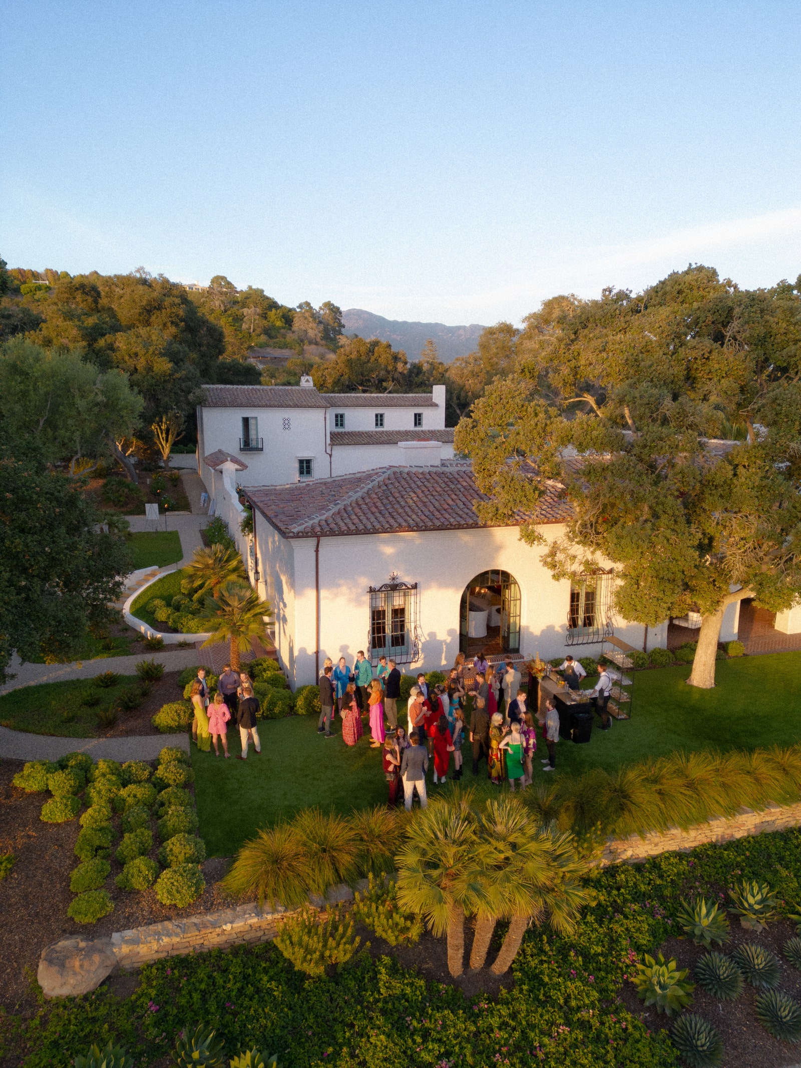 Image may contain building house housing, villa plant plant tree people in outdoor monastery and nature