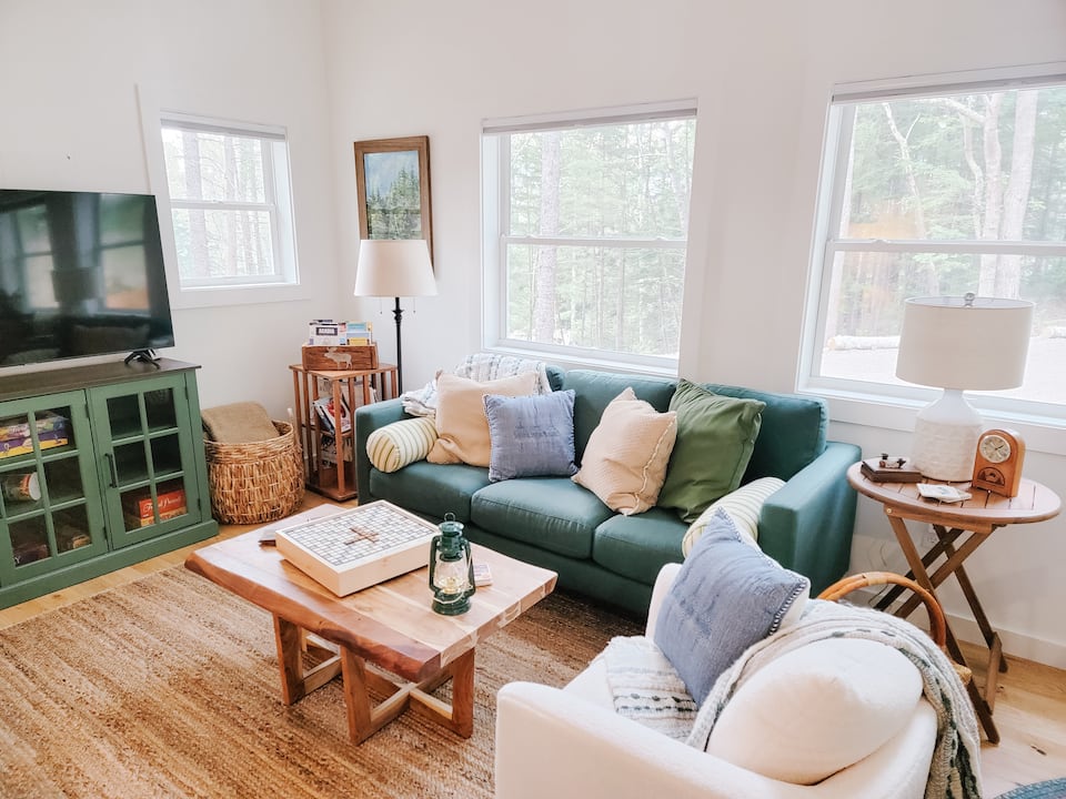 Image may contain lamps, sofas, furniture, home decoration, table building in indoor living room and room