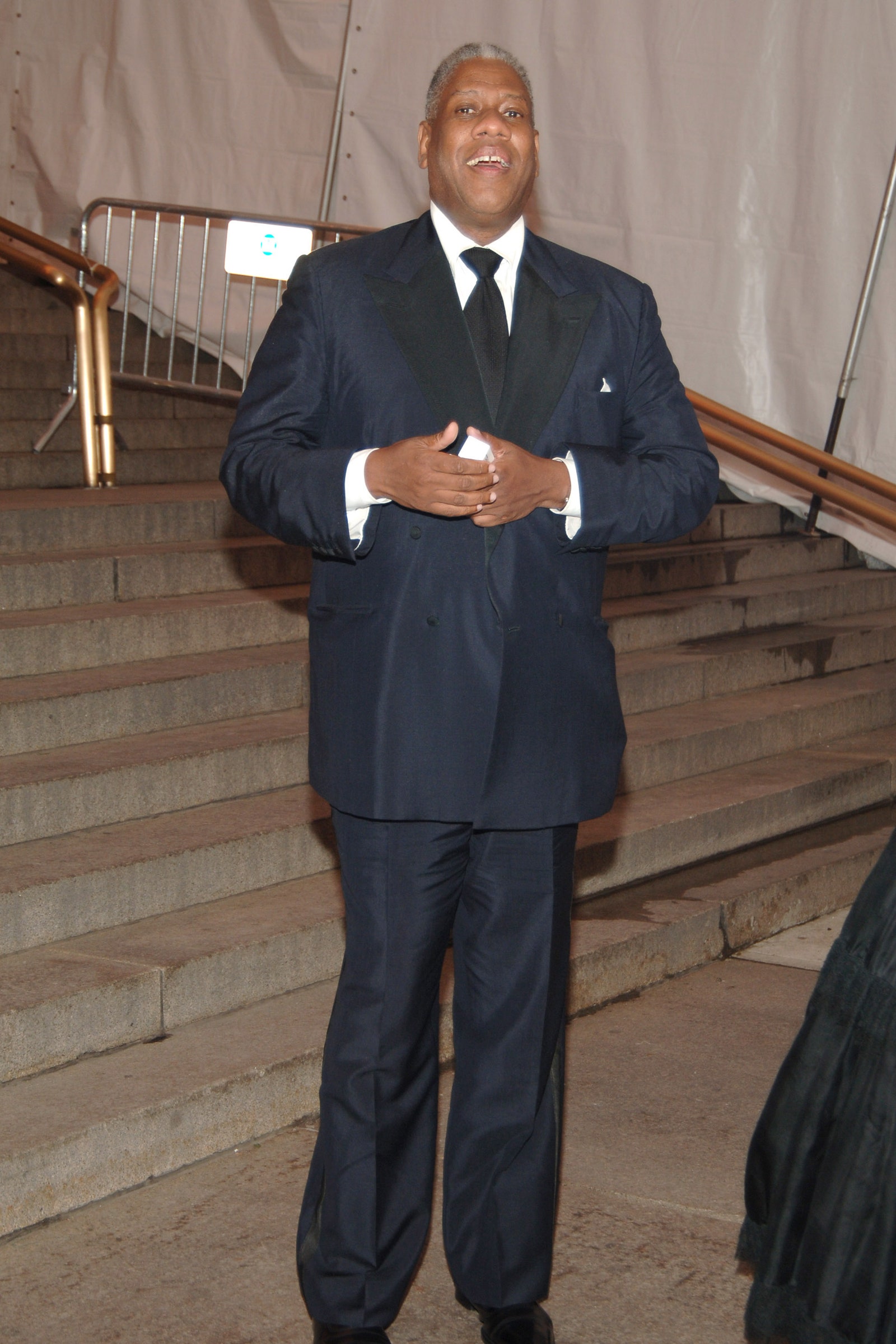 Images may contain Andr Leon Talley Blazer jacket formally wearing suit staff standing and building