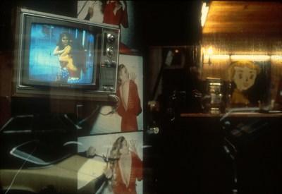 A monitor in a salon storefront.