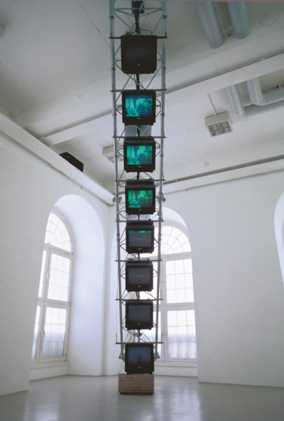 The TV screen hangs in the gallery.