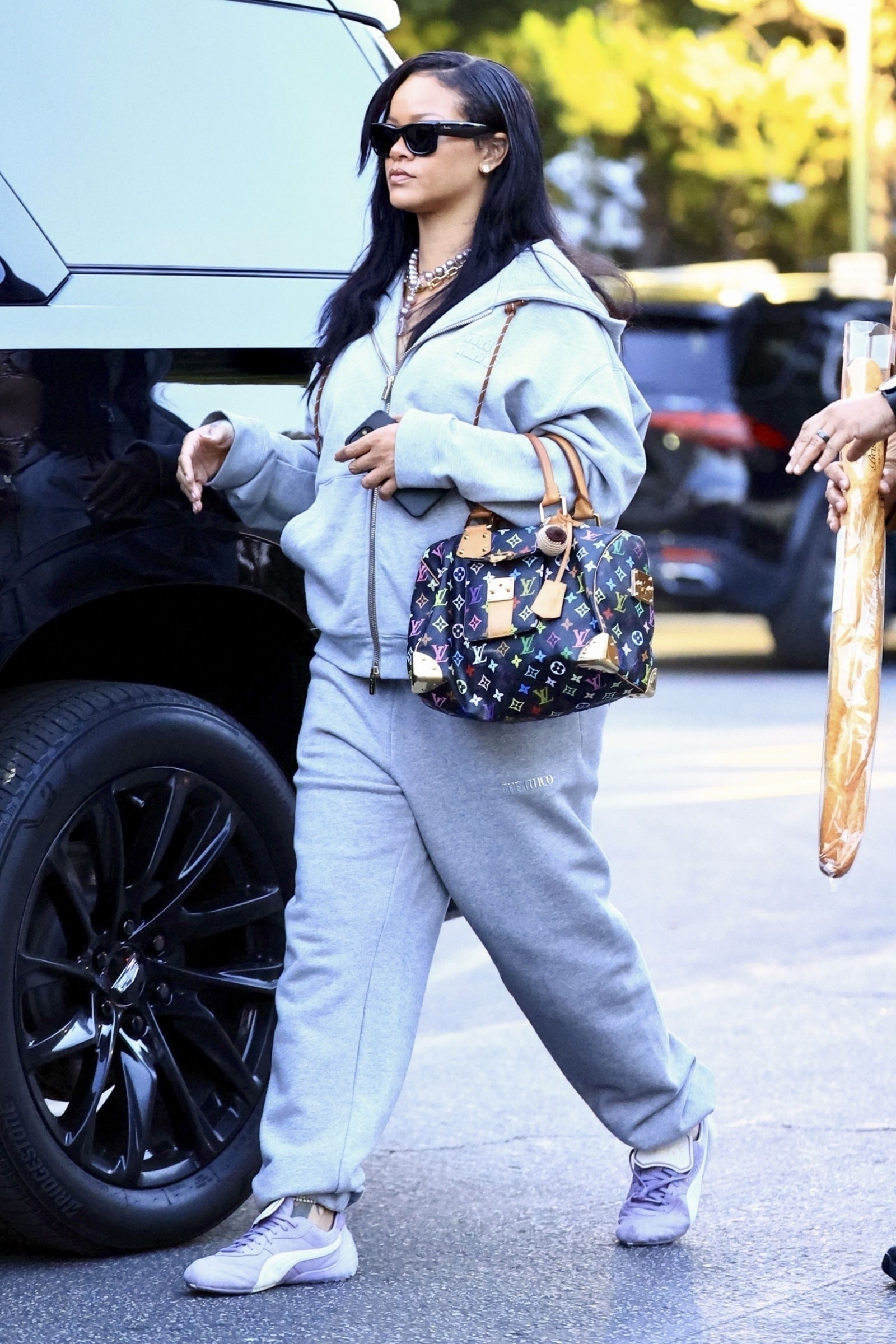 Los Angeles CA exclusive Rihanna shops in light grey sportswear and Louis Vuitton's Bristol Farms...