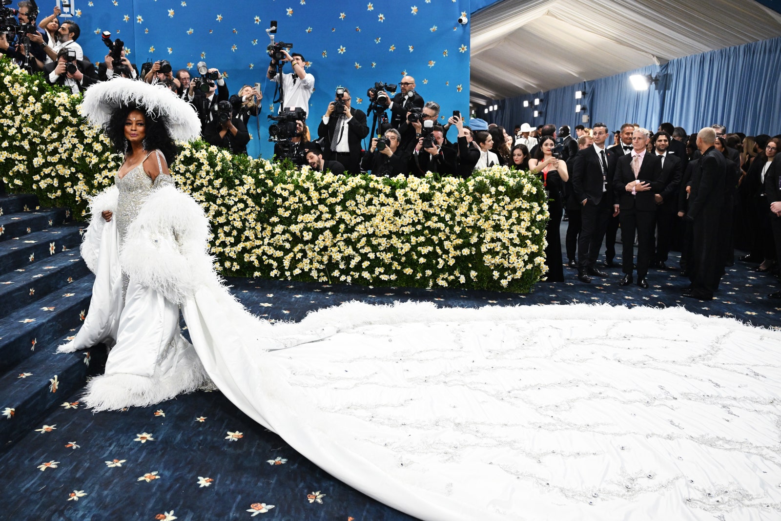 Images may contain Diana Ross Walter Jones adult wedding dress hat camera electronics and formal wear