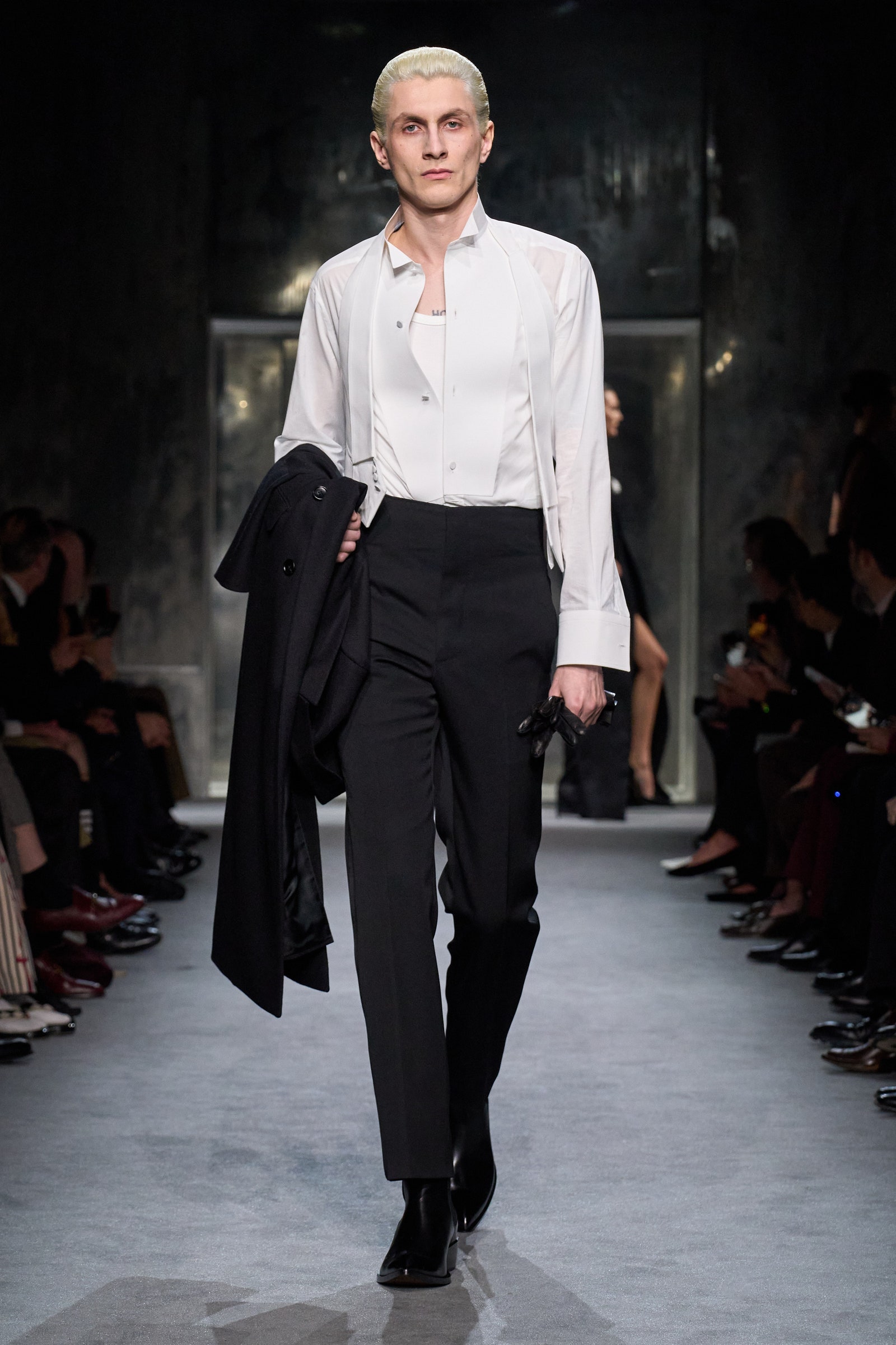 Images may contain adult standing clothes and coats
