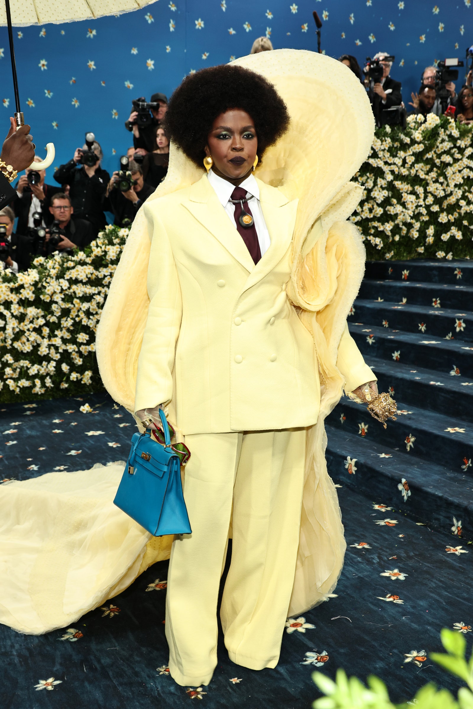 Images may contain face head and portrait of Lauryn Hill Bill Kenney Photography Glazer Clothing Jacket