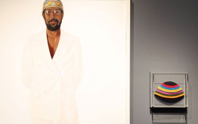 A cap is seen next to a painting during the press preview of The Costume Institute's exhibition "Superfine: Tailoring Black Style" at The Metropolitan Museum of Art in New York, May 5, 2025. (Photo by TIMOTHY A. CLARY / AFP) (Photo by TIMOTHY A. CLARY/AFP via Getty Images)