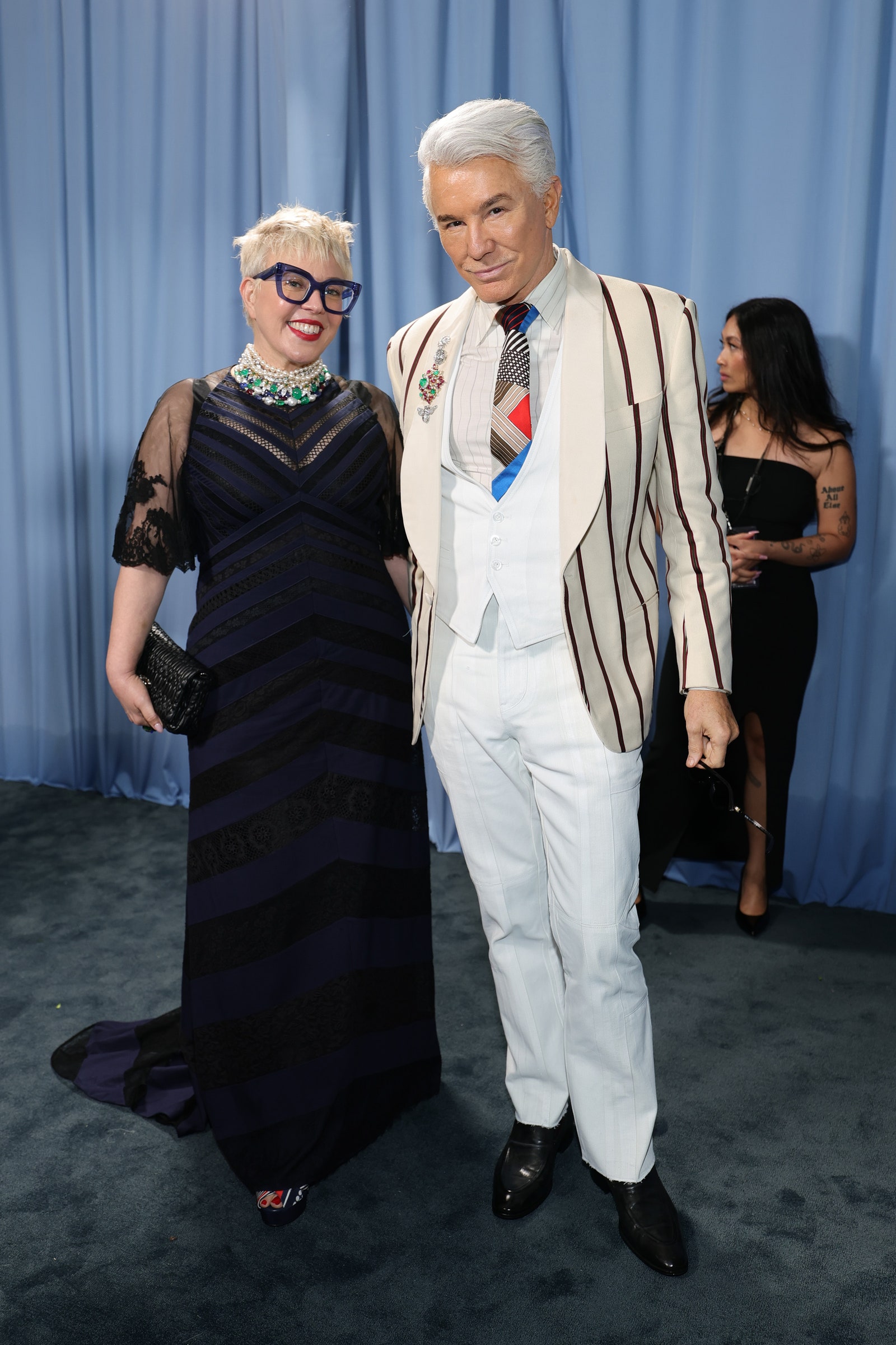Images may contain Baz Luhrmann Catherine Martin Happy Salma Persone Accessories Glasses Adult formal wear and tie